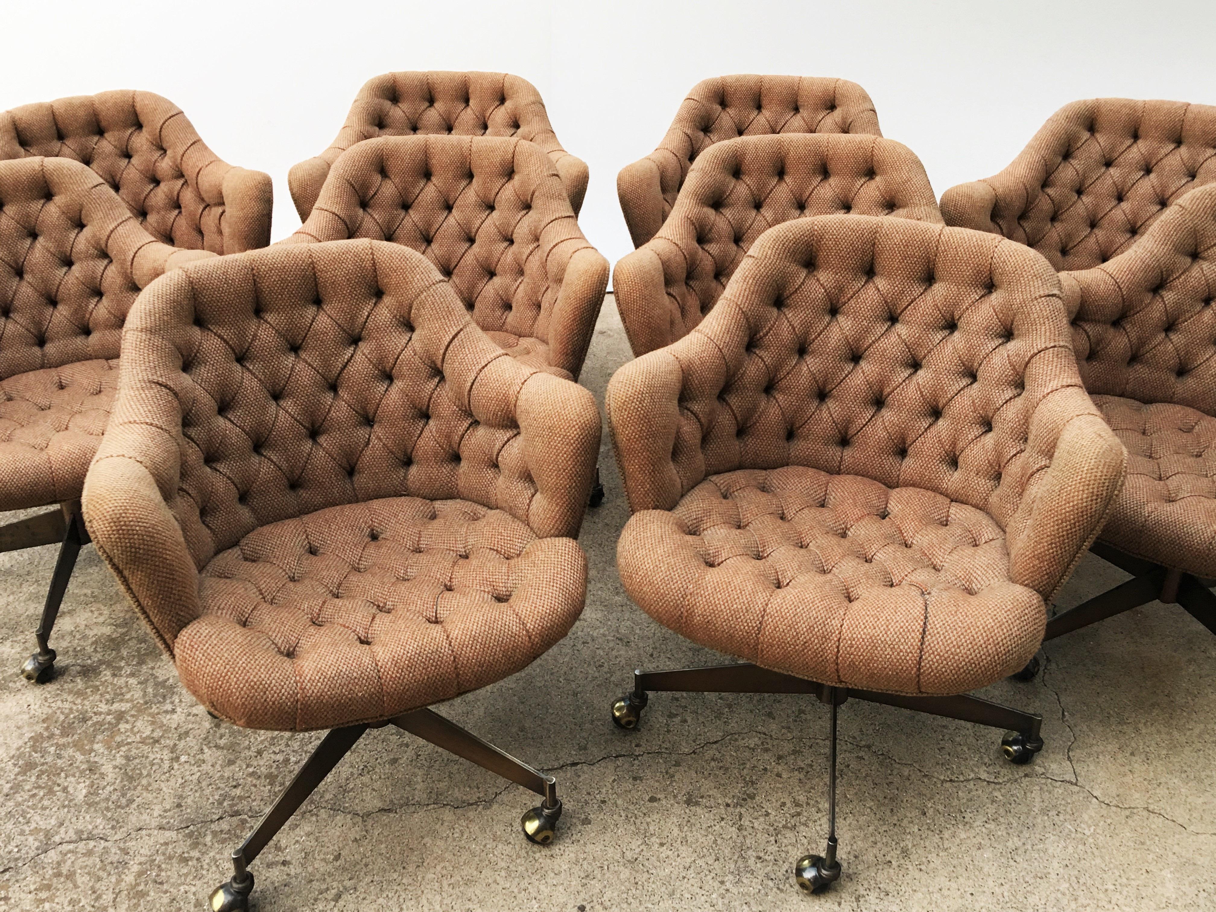 Set of ten modern sculptural design chairs by Jack Cartwright. Featuring deep tufted backs and seats with a 4-star brushed brass base on casters. Chairs tilt can be adjusted by a twist control located underneath the seat. Very good original vintage