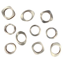 Set of Ten Modernist Cut Stainless Steel Napkin Rings