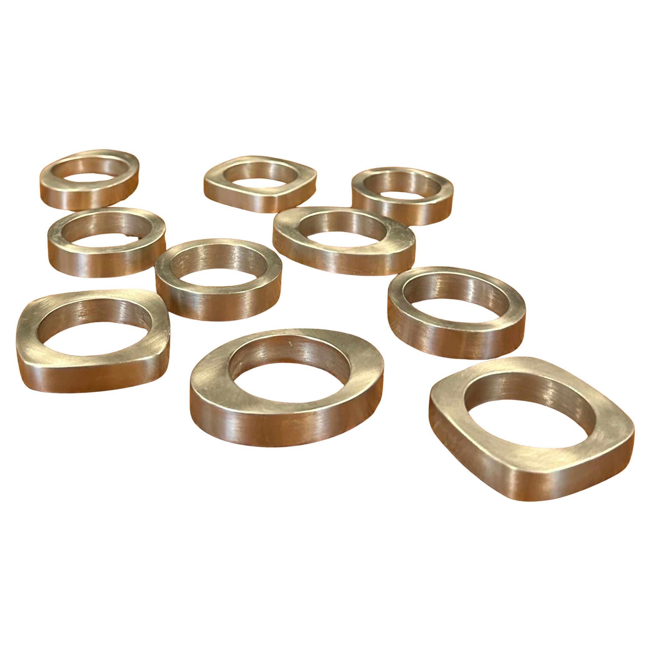 Set of Ten Modernist Cut Stainless Steel Napkin Rings