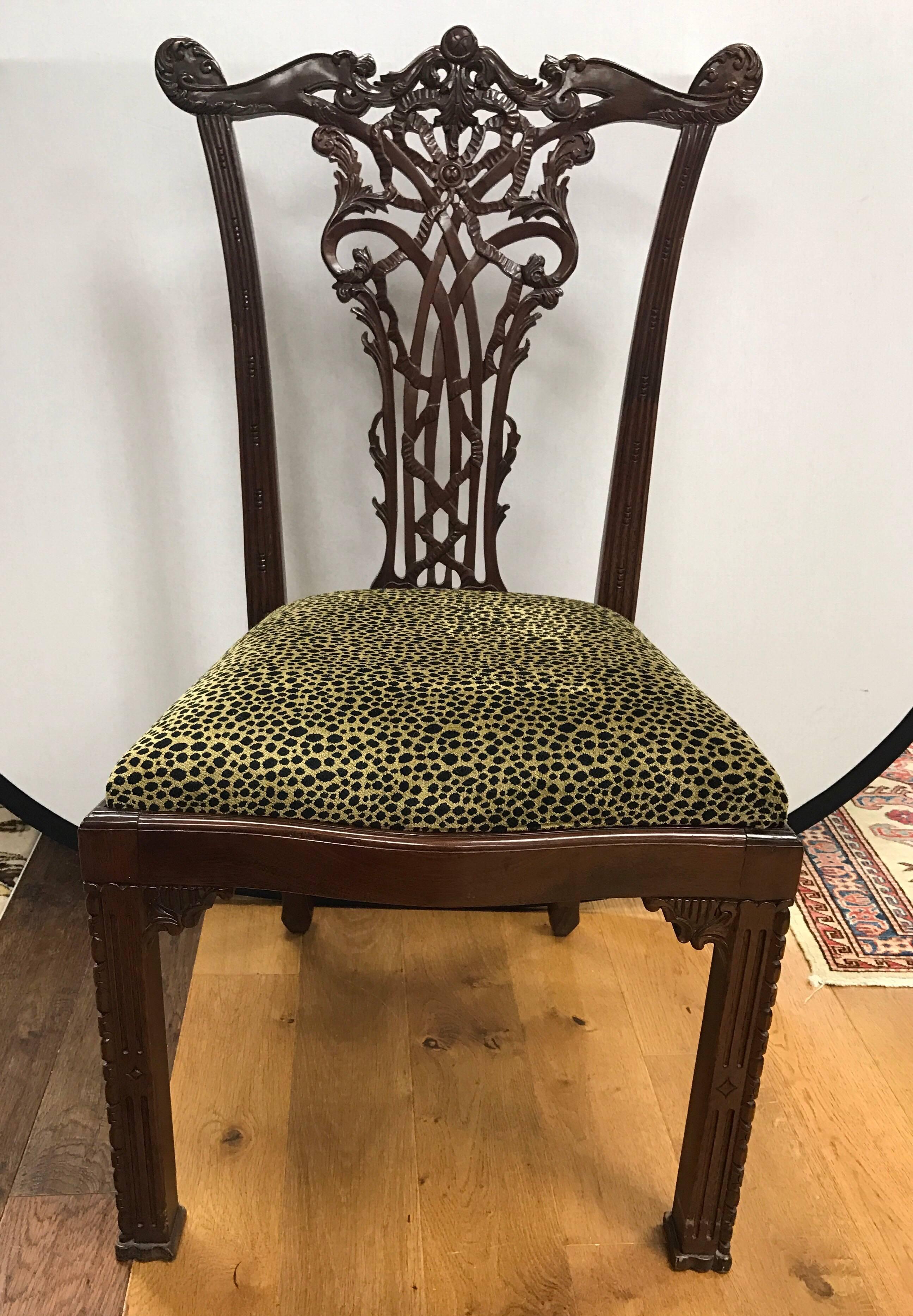 A very fine set of 19th century Chippendale mahogany dining chairs of superb quality and generous proportions with intricately carved back splat and blind fretwork on front legs. Includes eight side chairs and two armchairs. Drop in seats are easy