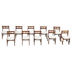 Set of ten oak brutalist razorback and bouclé dining chairs