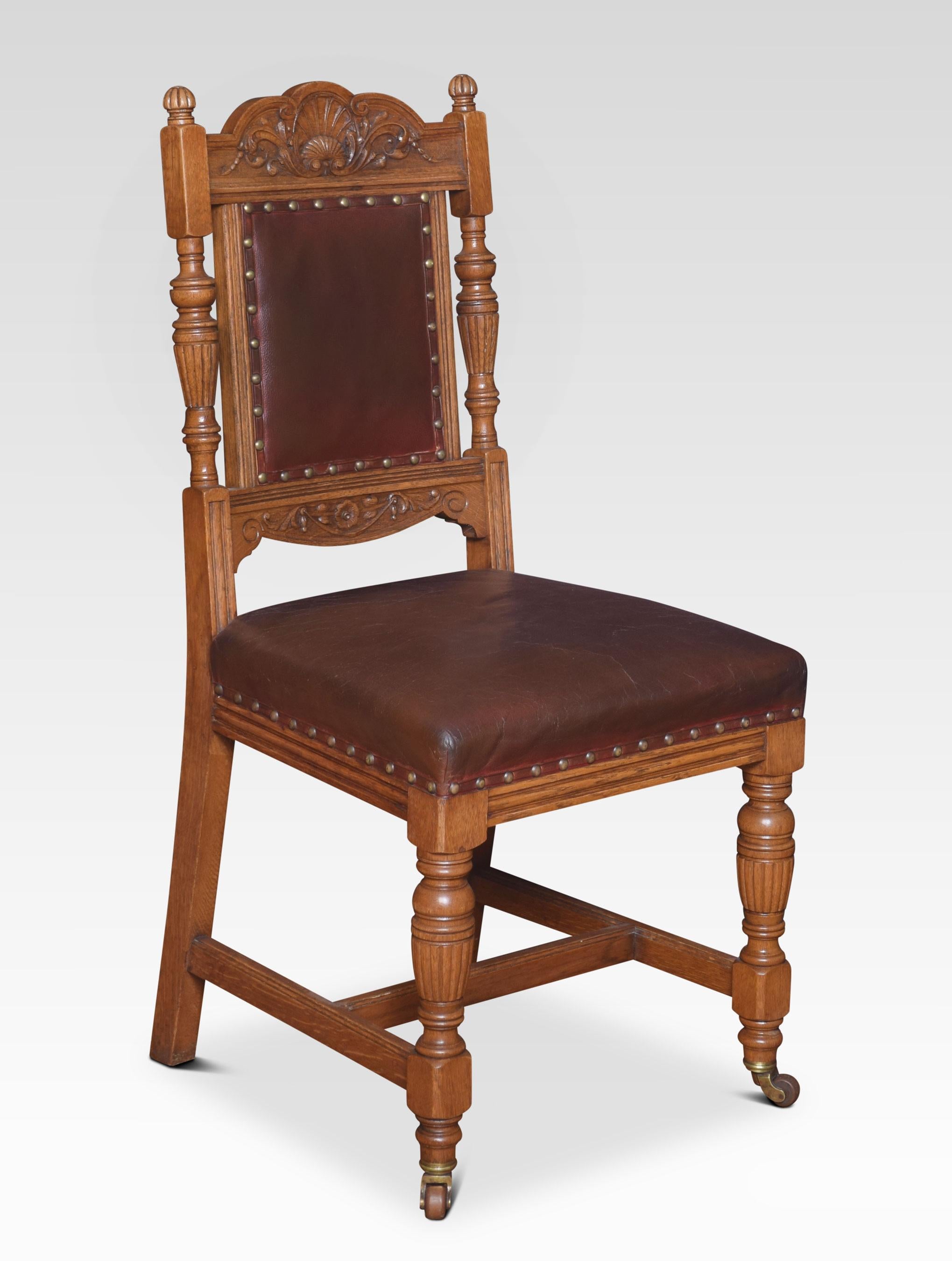 Set of ten oak dining chairs, each with scallop shell and leaf carved cresting rails, padded backs, and stuff over seats, each raised upon lobed fluted vase supports and casters joined by H-stretcher.
Dimensions:
Height 39 inches height to seat