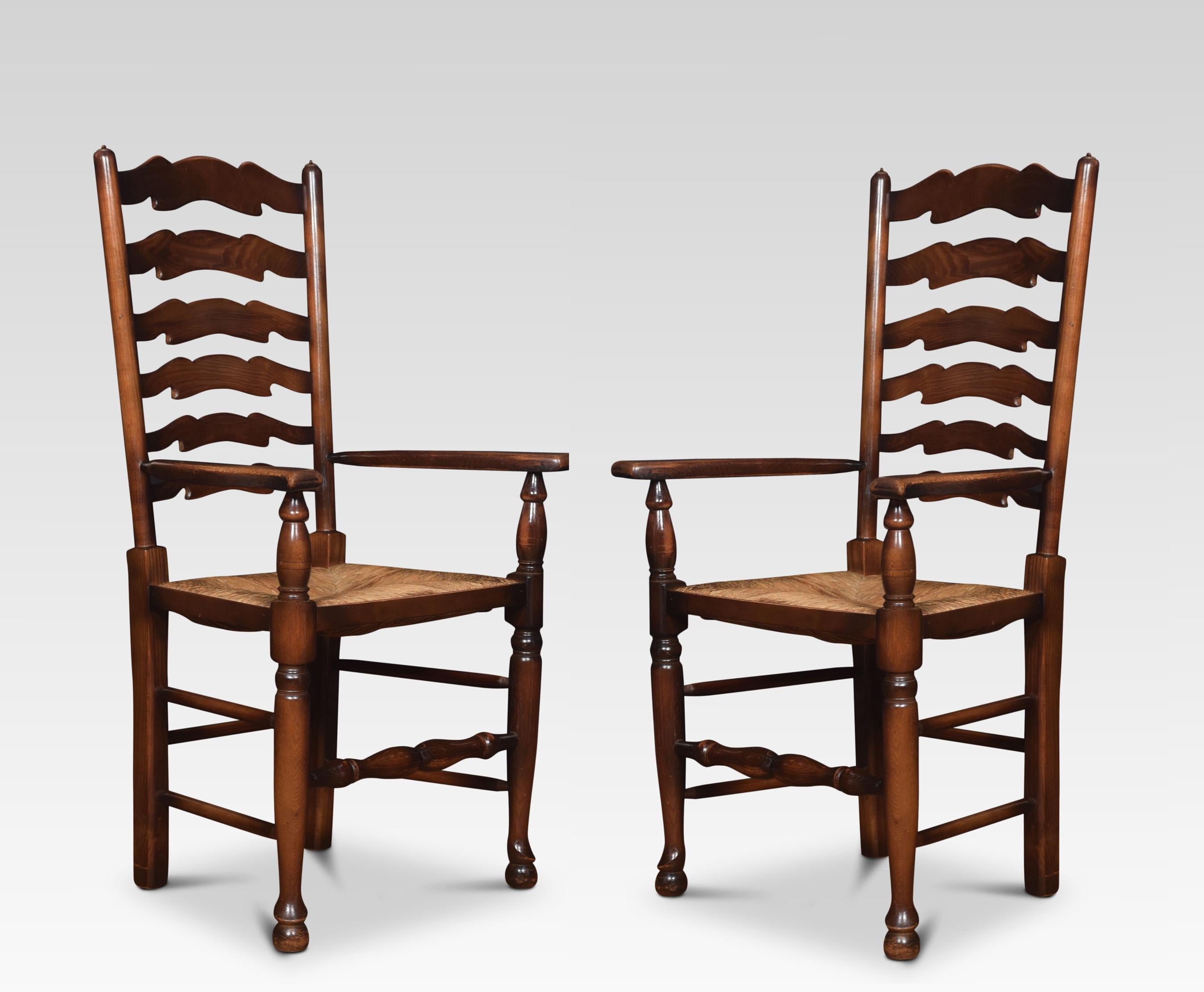 A set of ten ladder back oak dining chairs comprising of two armchairs and eight chairs, the ladder backs with rush seats on turned front legs united by stretchers.
Dimensions:
Armchairs
Height 42.5 inches height to seat 18.5 inches
Width 24