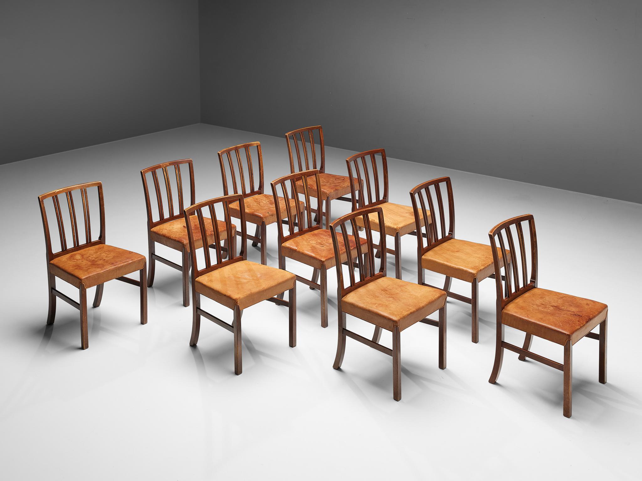 Ole Wanscher for Fritz Hansen, set of 10 dining chairs, walnut, cognac leather, Denmark, 1960s

Excellent set of dining chairs designed by Ole Wanscher for Fritz Hansen. The elegant model has a very notable backrest with a slight curve, flowing