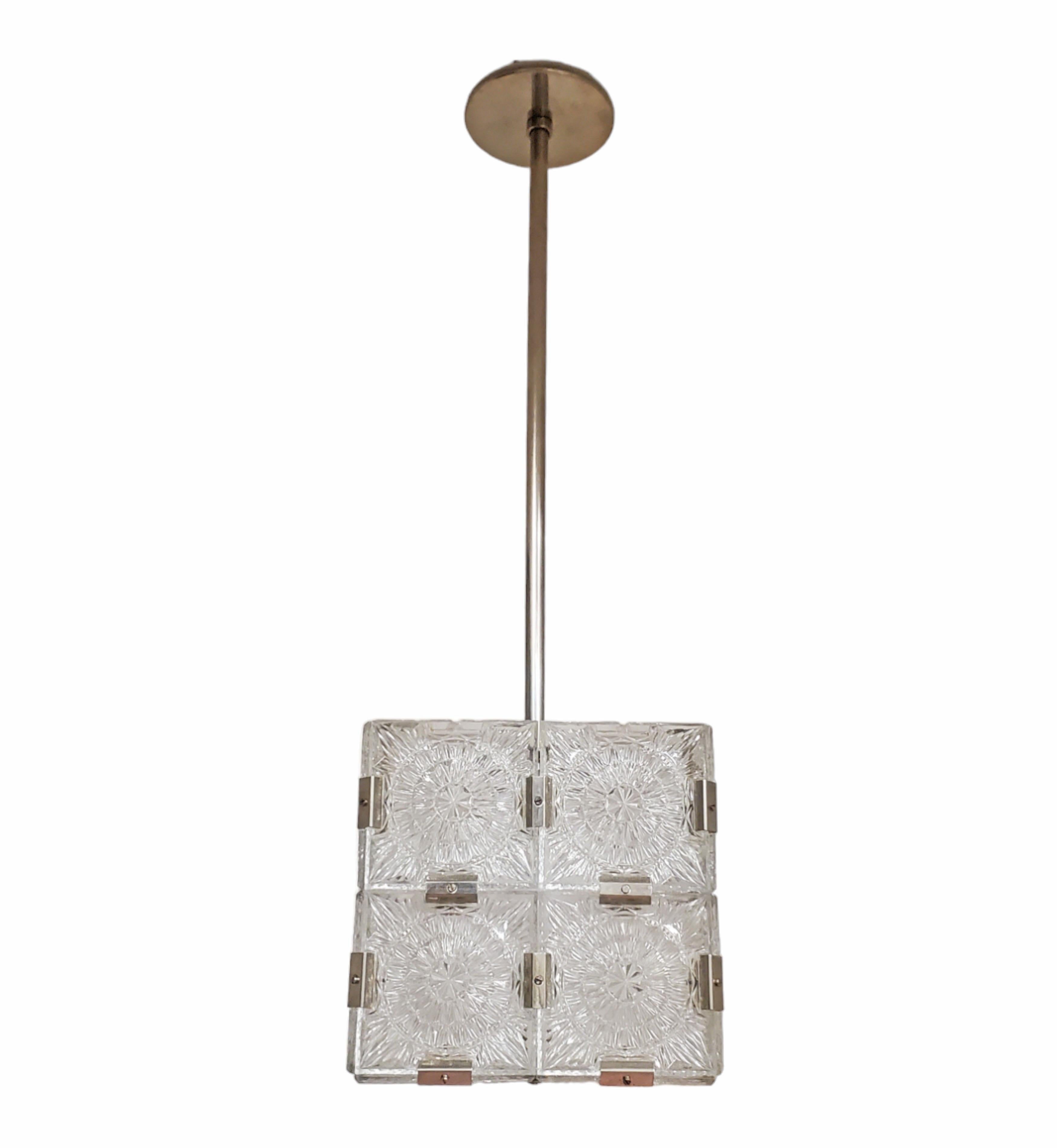 
Price listed is per one fixture.
Set of ten Modernist square chandeliers each fixture comprises 20 small squares of cut-glass in two tiers formed together with original nickeled bronze brackets. The juxtaposition of the circular patterns in the