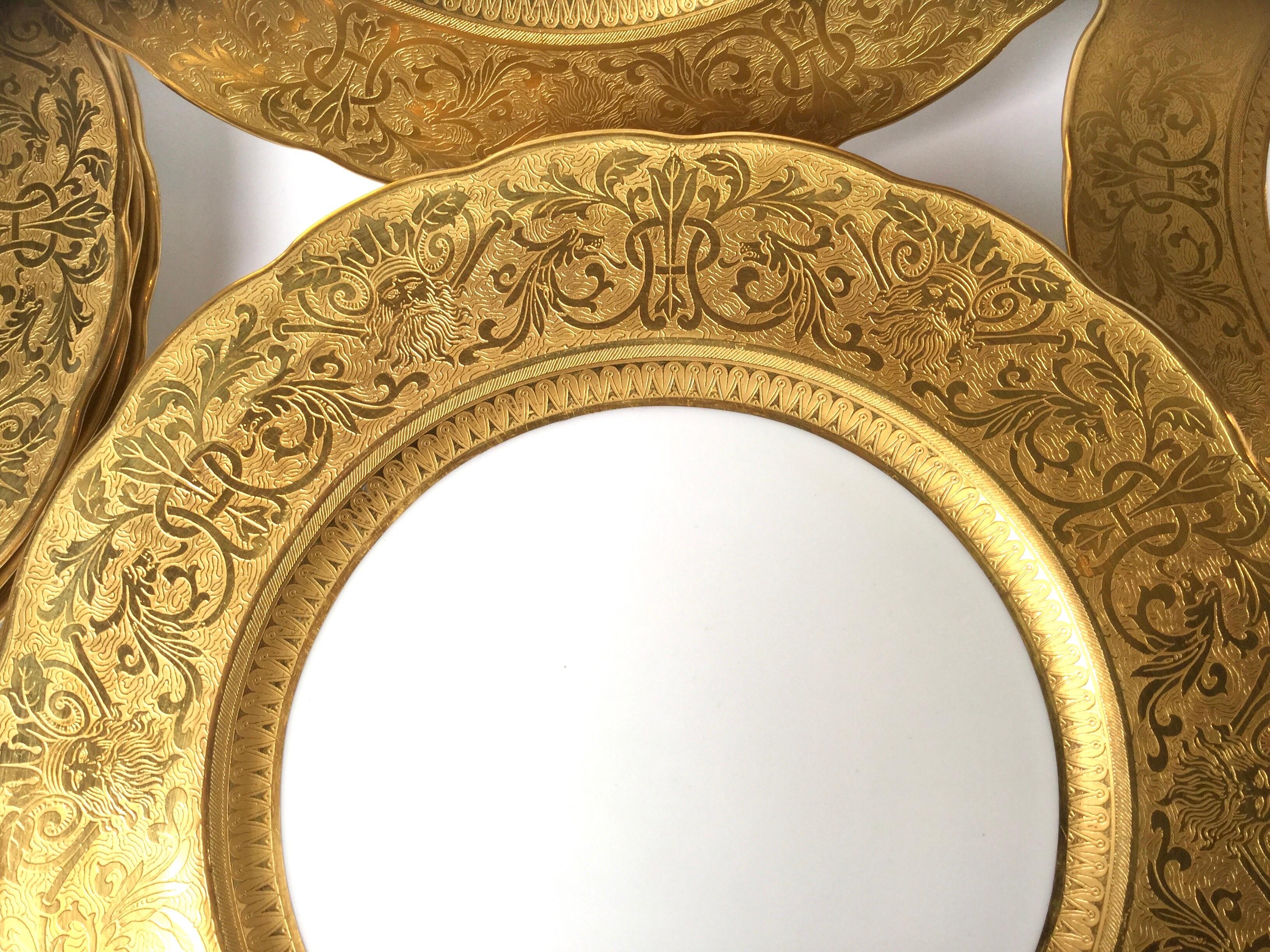 Porcelain Set of Ten Outstanding Gold Embossed Figural Head Service Plates