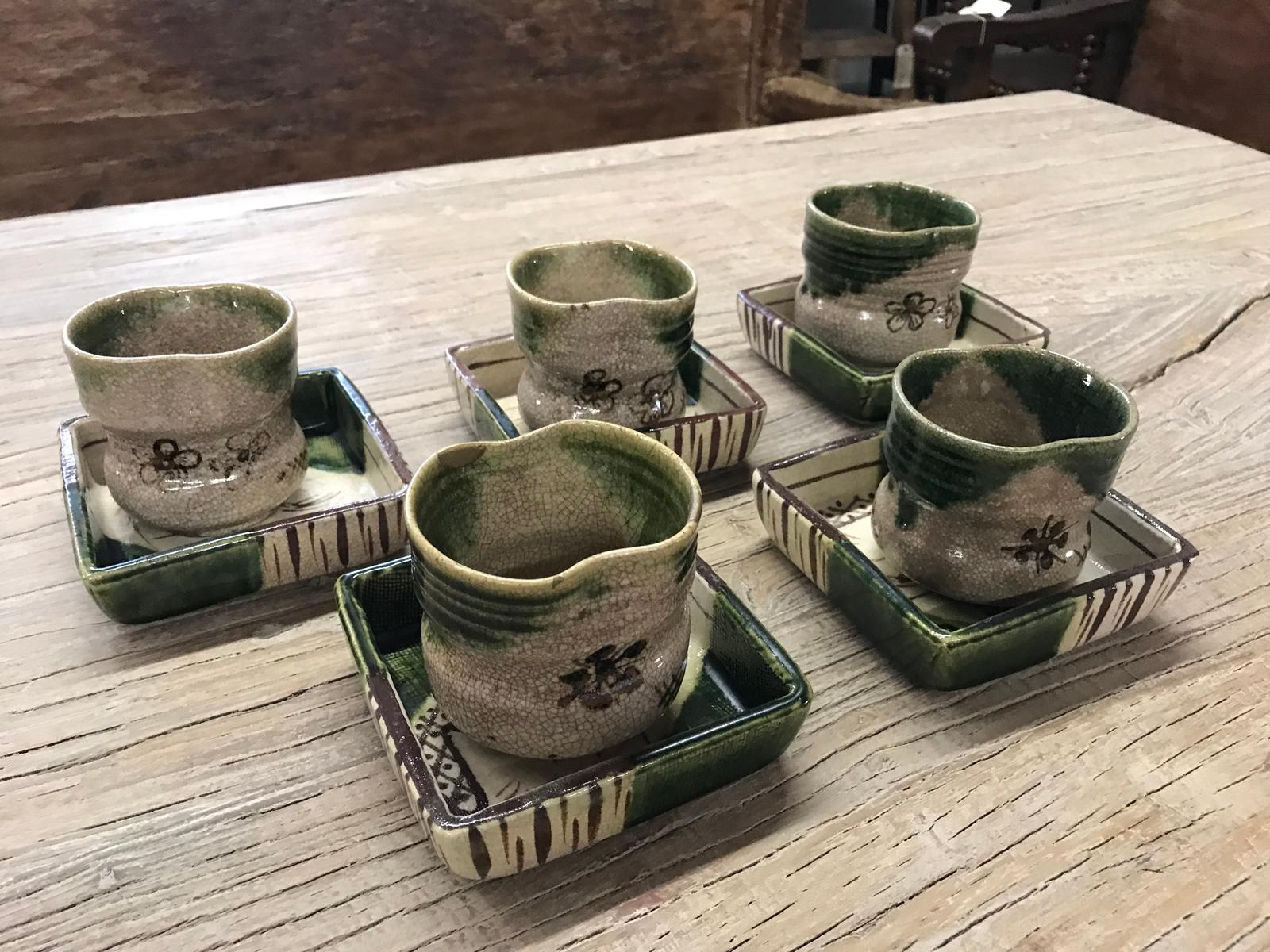 This listing is for a set of five cups and five plates for a total of ten pieces. $975 for the whole set. These are vintage Oribe pottery, a Japanese tea set. Pretty glaze, green and brown over beige. Beautiful crackling.
Cups measure about 3