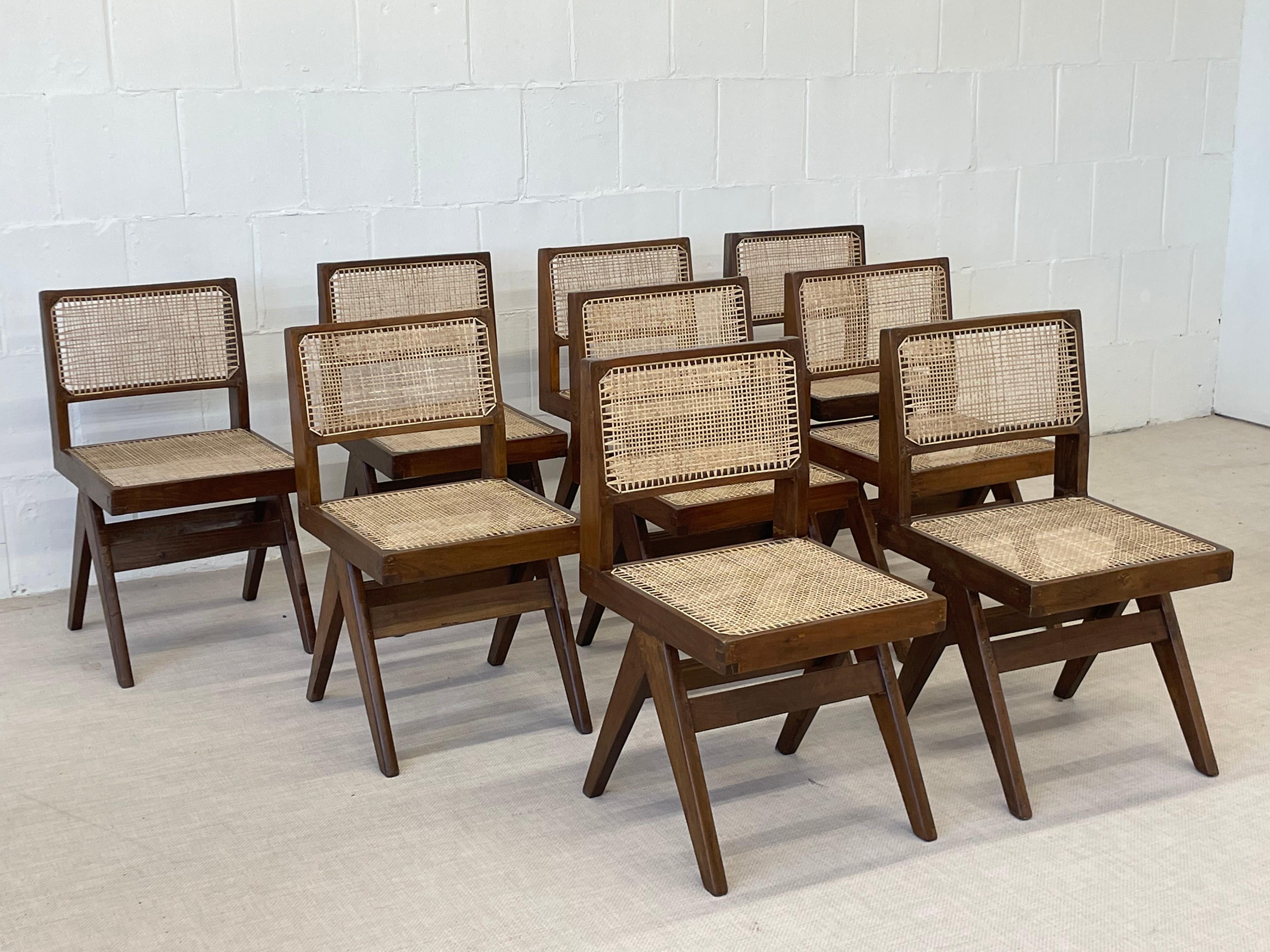 Set of ten (10) Pierre Jeanneret hand cane arm less dining chairs. A rare set of arm less dining chairs (not to restrict movement) re-polished and re-caned chairs in India. Dimensions vary slightly due to the handmade nature of this design.

These