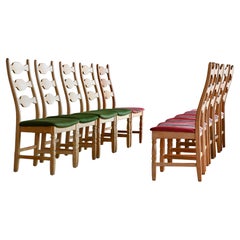 Set of Ten Razorblade Style Dining Chairs in Solid Carved Oak by Henry Kjærnulf
