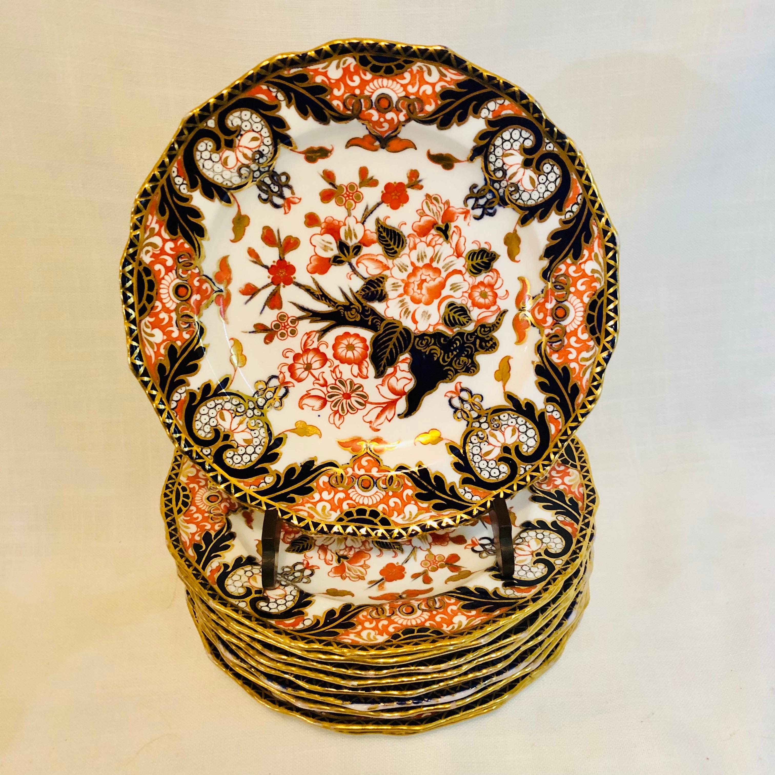 This is a stunning set of ten Royal Crown Derby imari pattern luncheon or dessert plates from 1888. They have a fluted border with cobalt and gold accents. The imari pattern painting on these plates is beautiful and very detailed. They would make an
