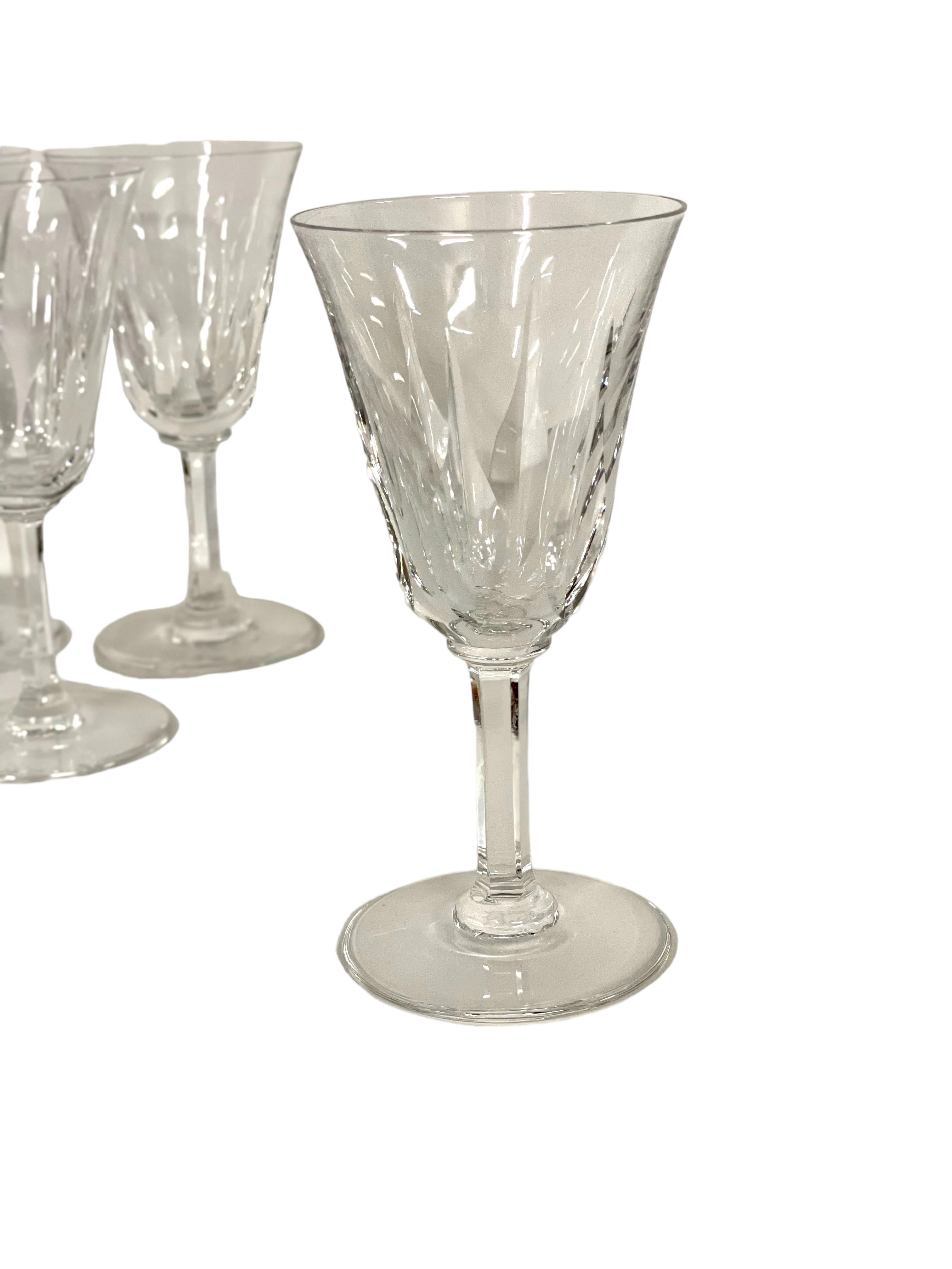 An exceptional set of 10 crystal red wine glasses in sparkling Saint-Louis crystal. The tulip- shaped chalice of each is cut with tall and pointed lozenges, while the stem features elegantly cut flat ribs. The glasses are all stamped 'Saint-Louis'
