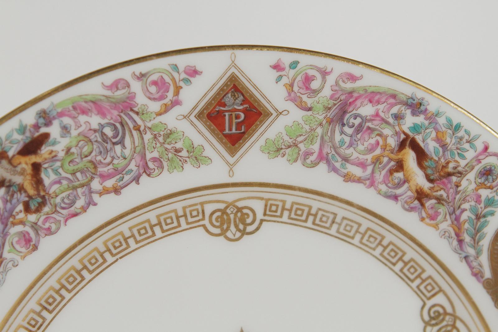 Set of ten Sevres Royal service Chateau de Fontaine bleau plates France, circa 1846. Each plate decorated with Greek key patter and border of beasts among folliage interspersed with LP monograms and cartouches. The plates with Central starburst
