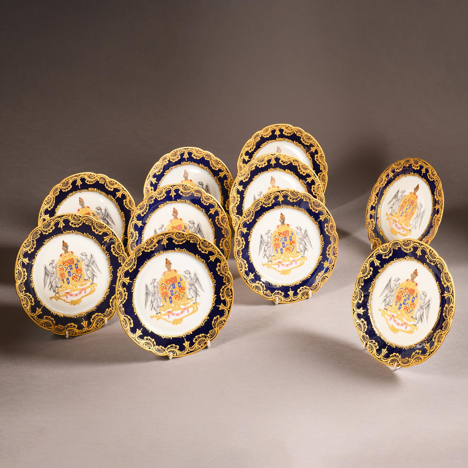 A Fine Set of Ten Sèvres-Style Armorial Cabinet Plates. 

Marked to the reverse with blue underglaze interlaced ‘L’s’.

Each plate is finely painted and gilt with a dark powder-blue scalloped border and pendant husks, centred by  the arms of the