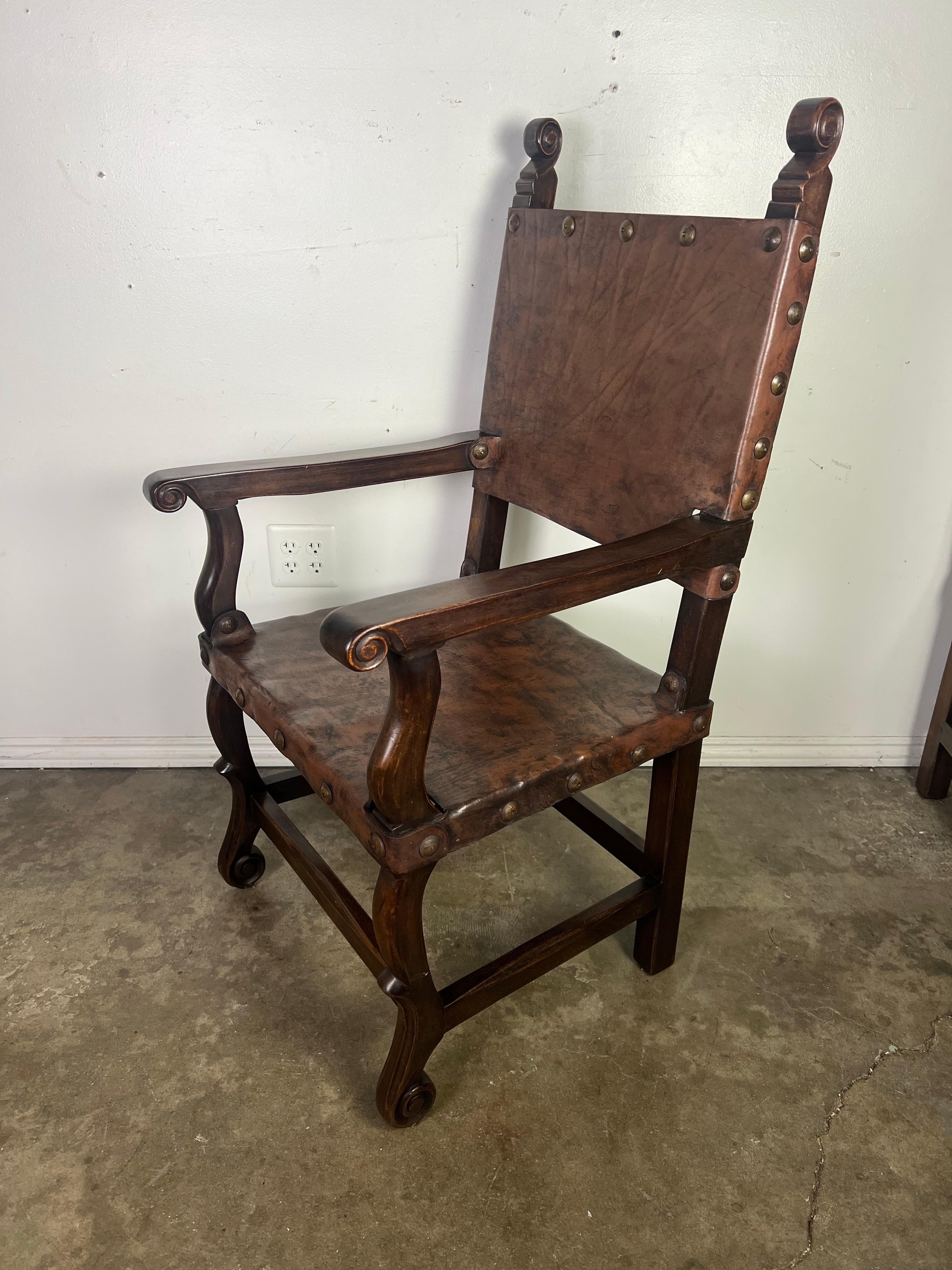 Set of Ten Spanish Leather Dining Chairs C. 1940's In Distressed Condition For Sale In Los Angeles, CA