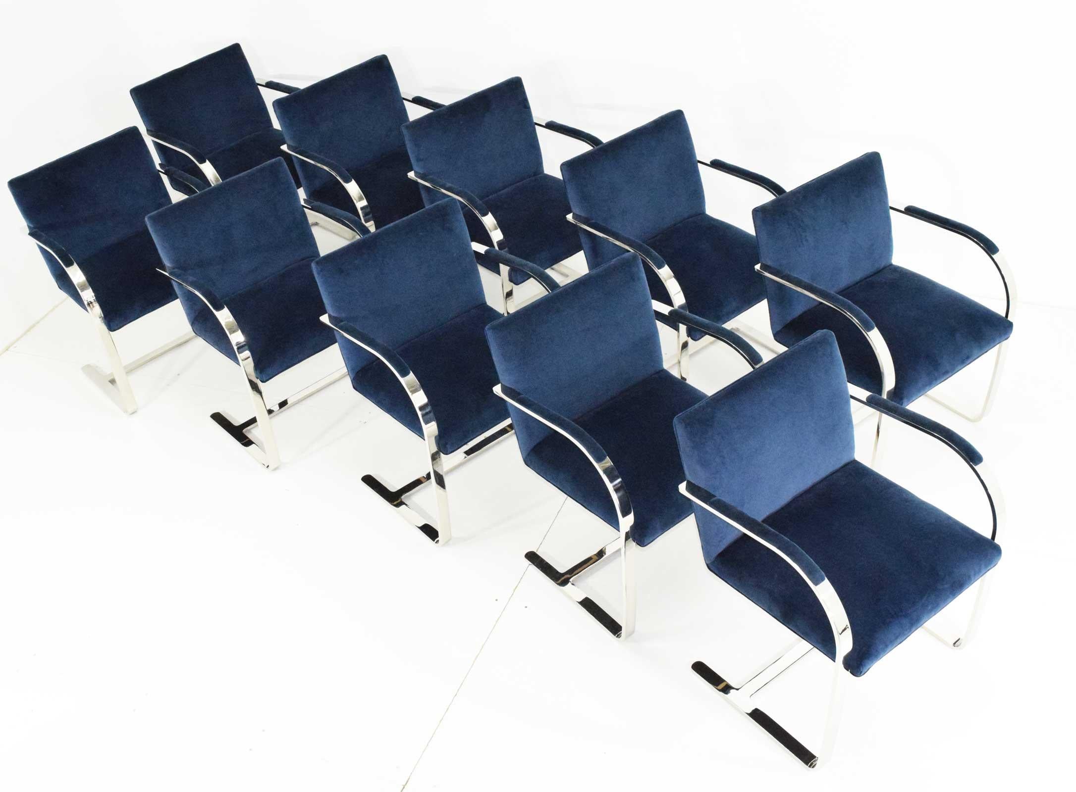 Beautiful set of ten Brno chairs designed by Mies van der Rohe. Chairs are upholstered in a blue velvet. They show wonderfully. Chairs are stainless steel and include the padded arms. 

Chairs are ready to go just in time for the holidays. 

We