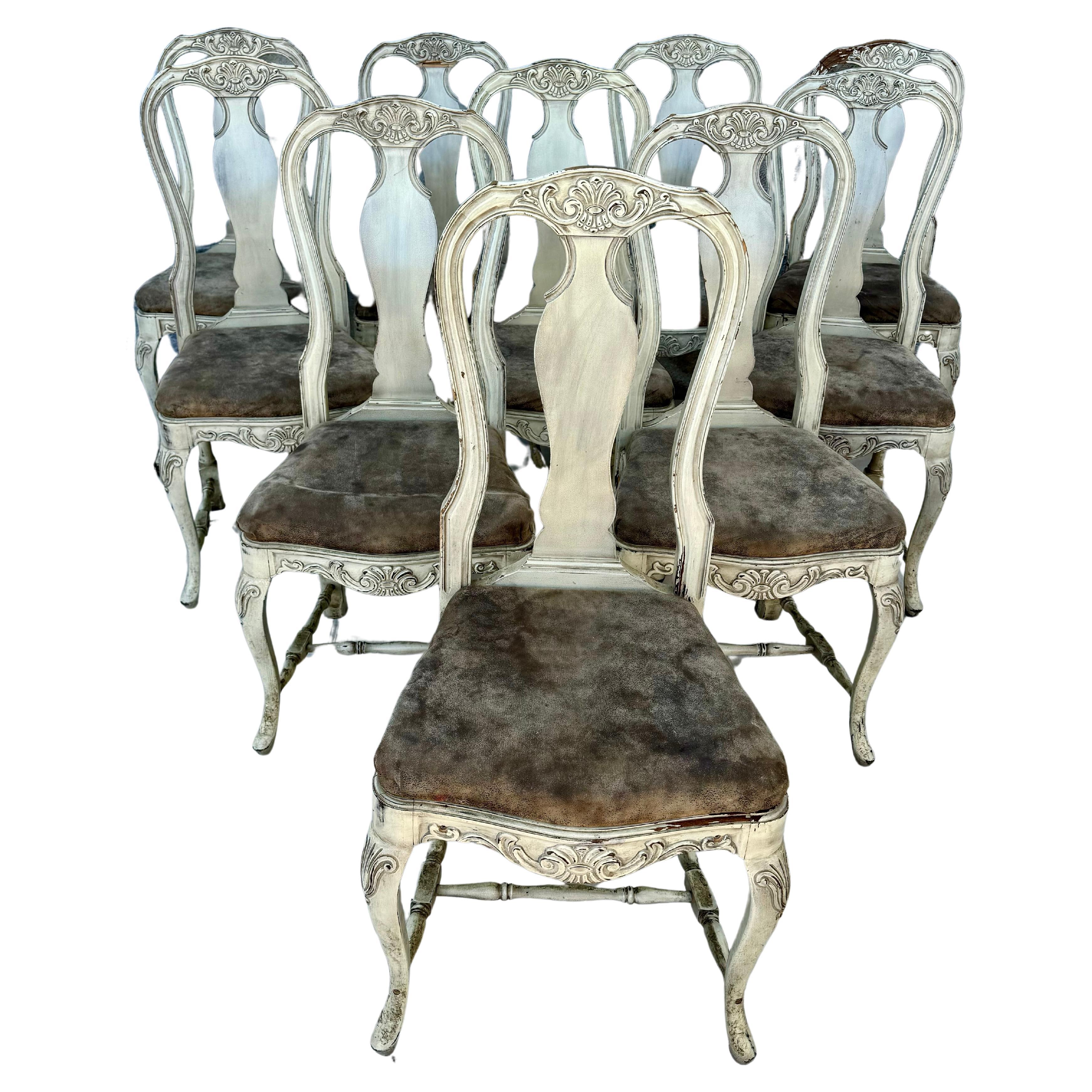 Fine set of ten (10) mid 20th century Swedish Rococo style dining chairs. Lovely chairs feature ornate carved details, shapely curved backs and cabriolet legs, with seats upholstered in brown leather fabric. Each chair is supported by an H stretcher.