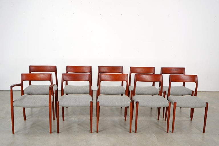 This set of ten chairs was designed by Niels O. Møller in the 1960s and was produced in Denmark by J.L Møllers. This set features nine dining side chairs and one armchair. All chairs are in a very good restored condition and feature were