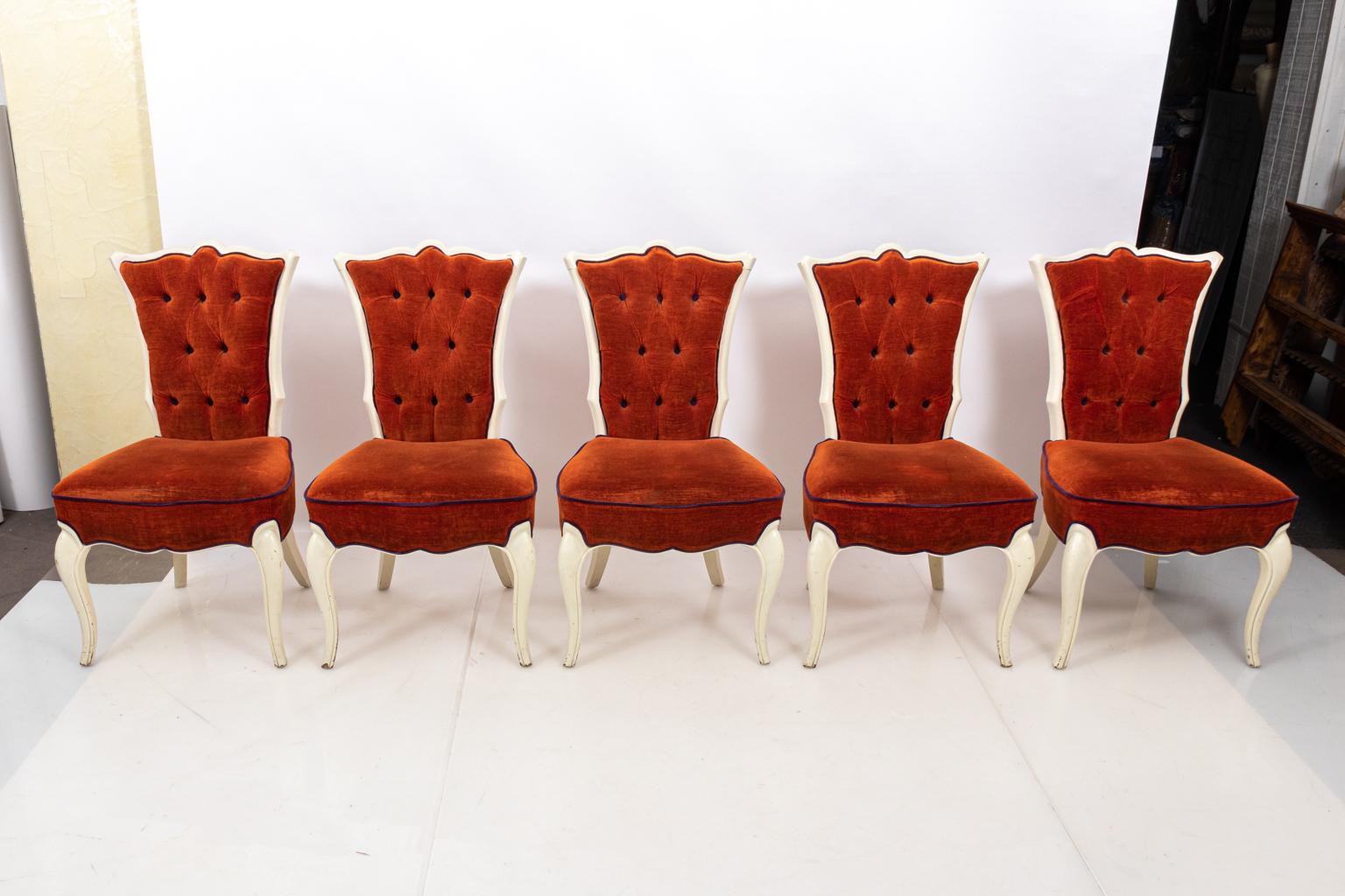 Set of ten upholstered Hollywood Regency style side chairs with tufted backs and white painted frame. Please note of wear consistent with age including scuffs and scratches to the wood, button loss, and wear to the upholstery.