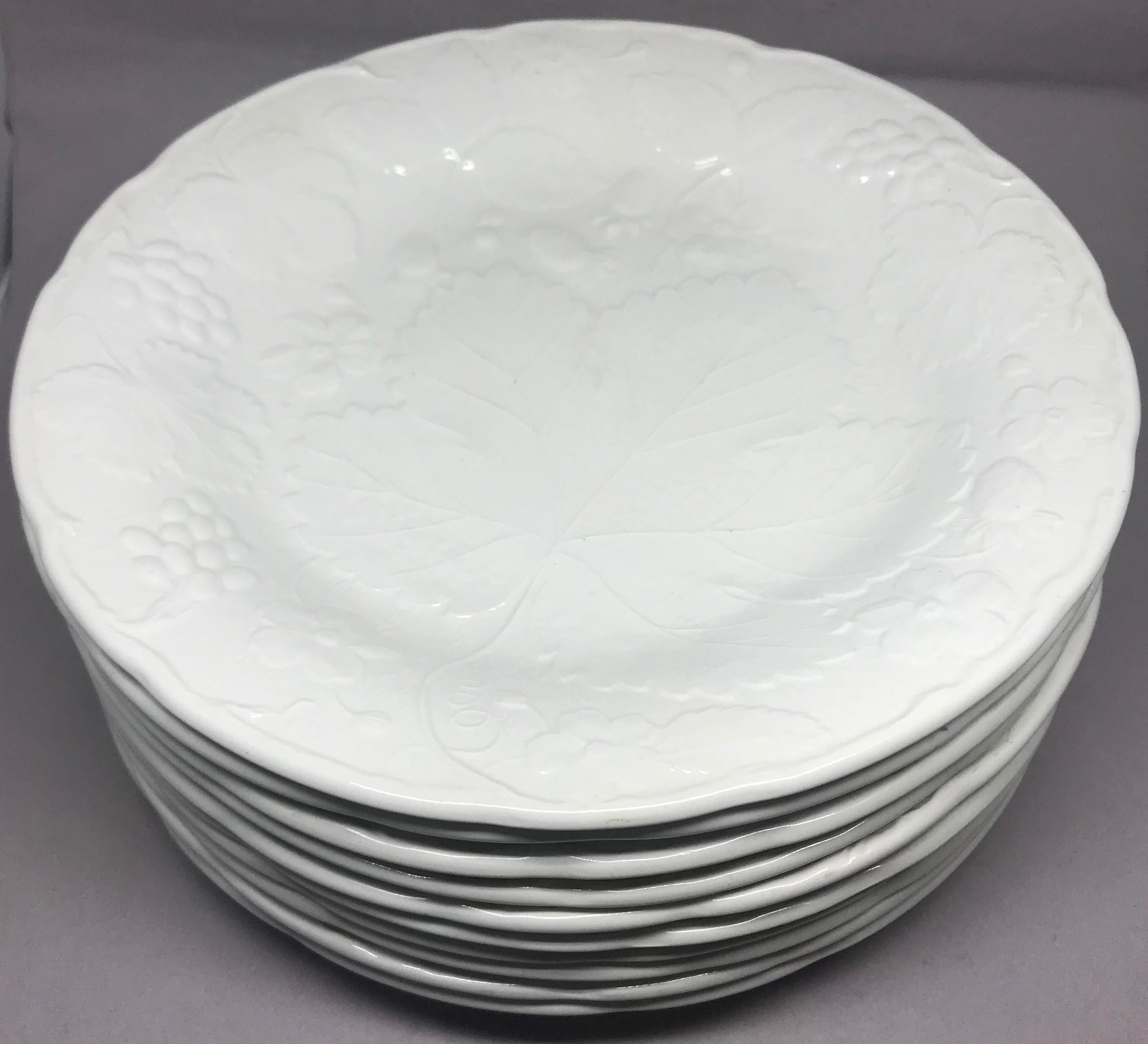 Set of ten white strawberry leaf dinner plates. Davenport Burleigh dinner plates in the strawberry and grape leaf pattern, England, 20th century.
Dinner plate dimensions: 9.88