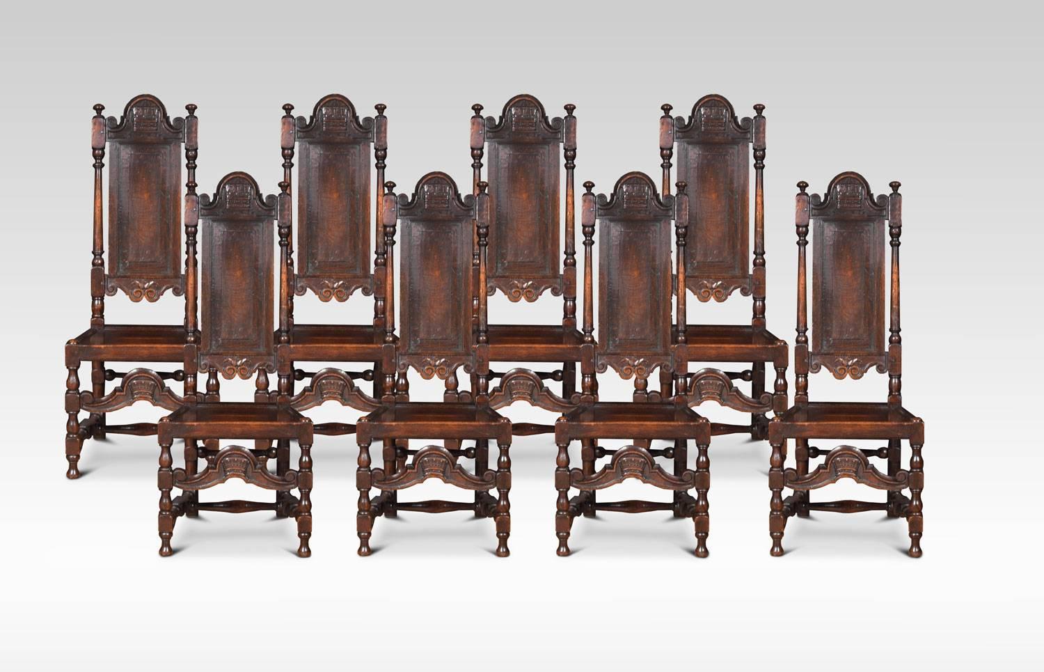 Set of ten 19th century oak chairs in the William and Mary style, consisting of two Carver armchairs, and eight side chairs, all having arched cresting rails with carved crowns. To the fielded panelled backs flanked by turned supports. The solid oak