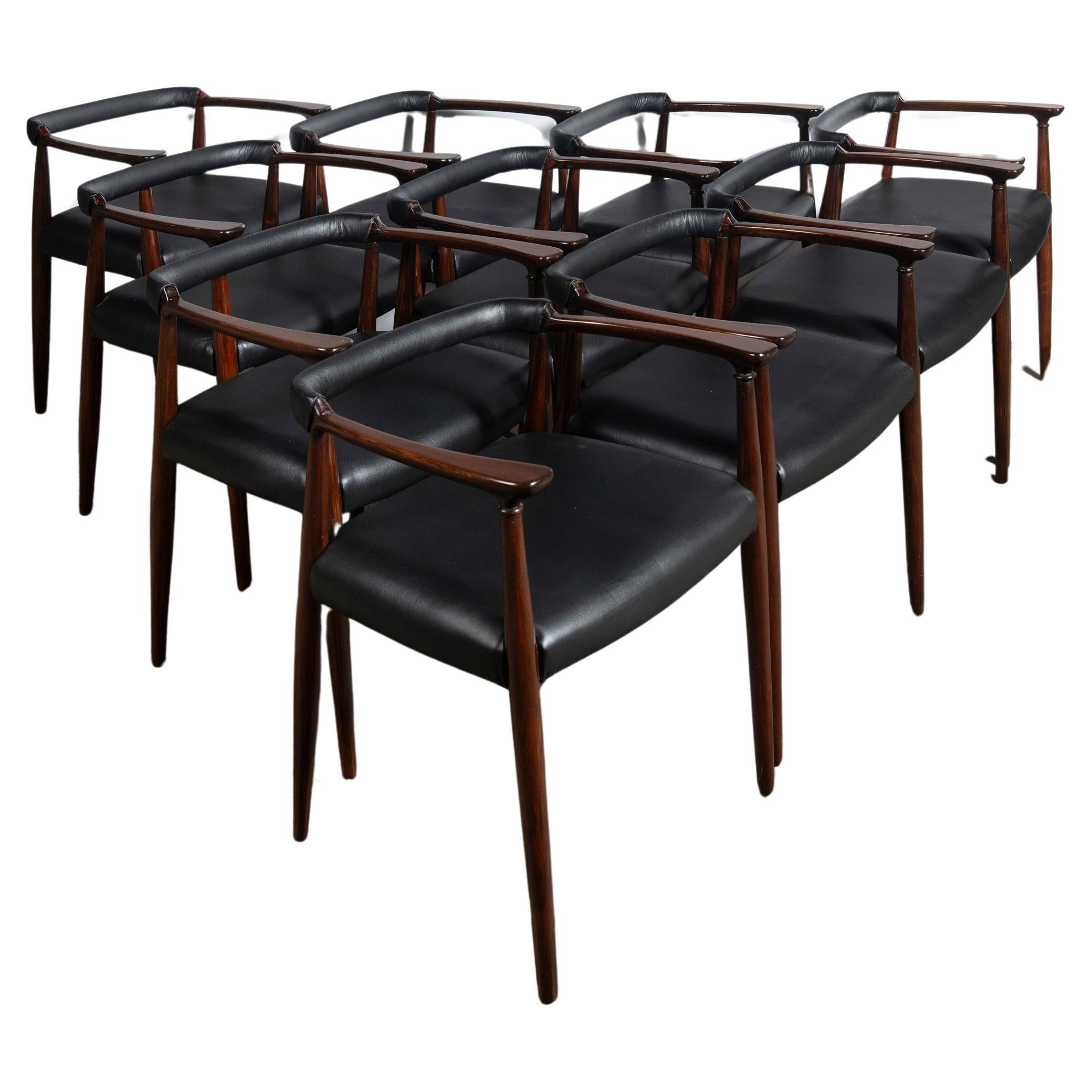 Set of ten wood and leather dining chairs designed by Alberto Churba, c. 1970. For Sale
