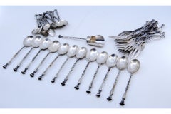 Set of thirty-seven silver units, forks, tea & coffee spoons w/ applied reliefs