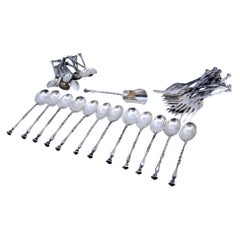 Set of thirty-seven silver units, forks, tea
coffee spoons w/ applied reliefs