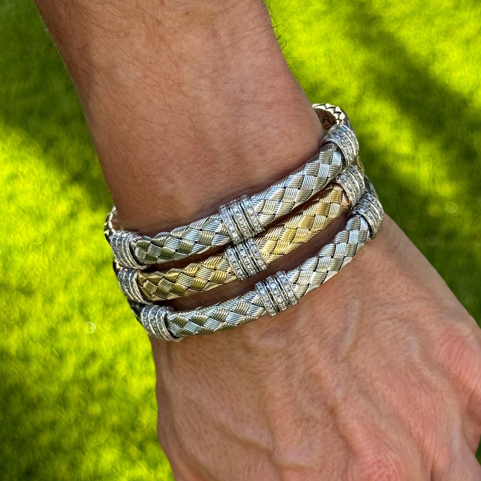 Exuding Italian artistry and timeless elegance, this exquisite set of three woven gold diamond bracelets offers exceptional craftsmanship and versatile style. The collection includes two bracelets in 14K white gold and one in 14K yellow gold, each