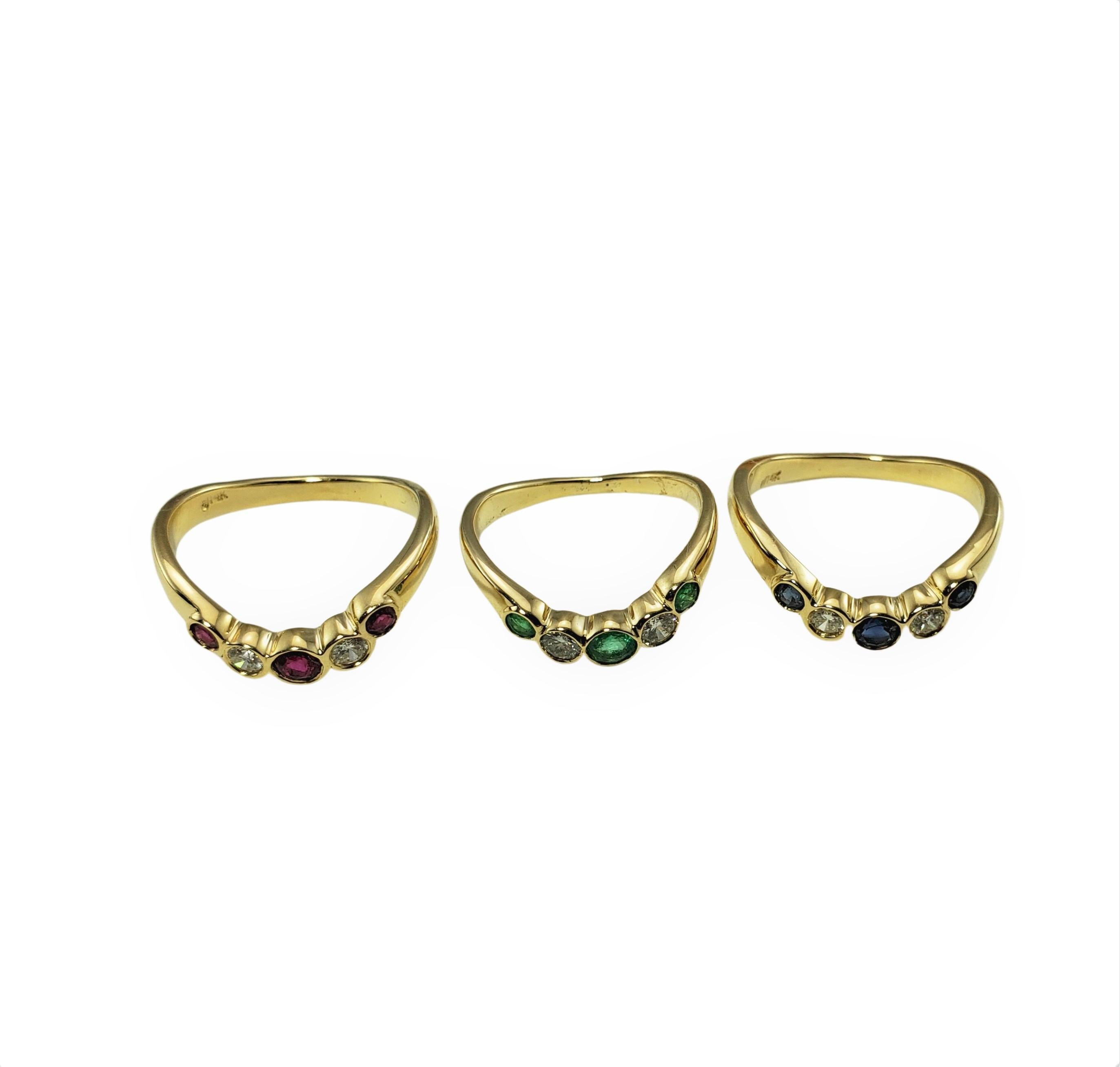 Set of Three 14 Karat Yellow Gold Emerald/Ruby/Sapphire and Diamond Rings Size 5.5-6.25

This set of three rings each feature three round gemstones (emerald, ruby, sapphire) and two round brilliant cut diamonds set in classic 14K yellow gold.  Width