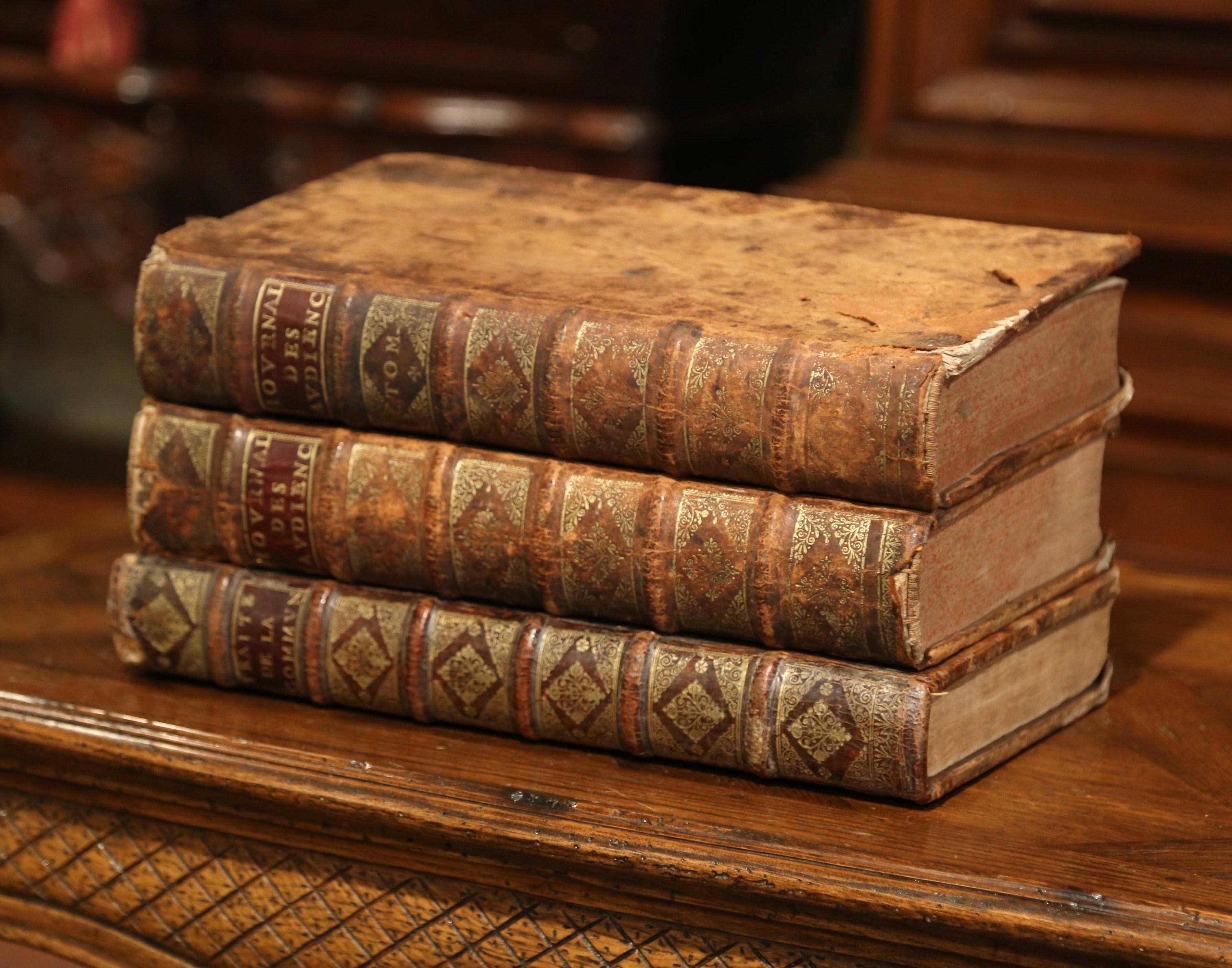 Decorate a library or an office with these three large antique law books. Dated respectively 1692, 1699 and 1700, these leather bound books called 