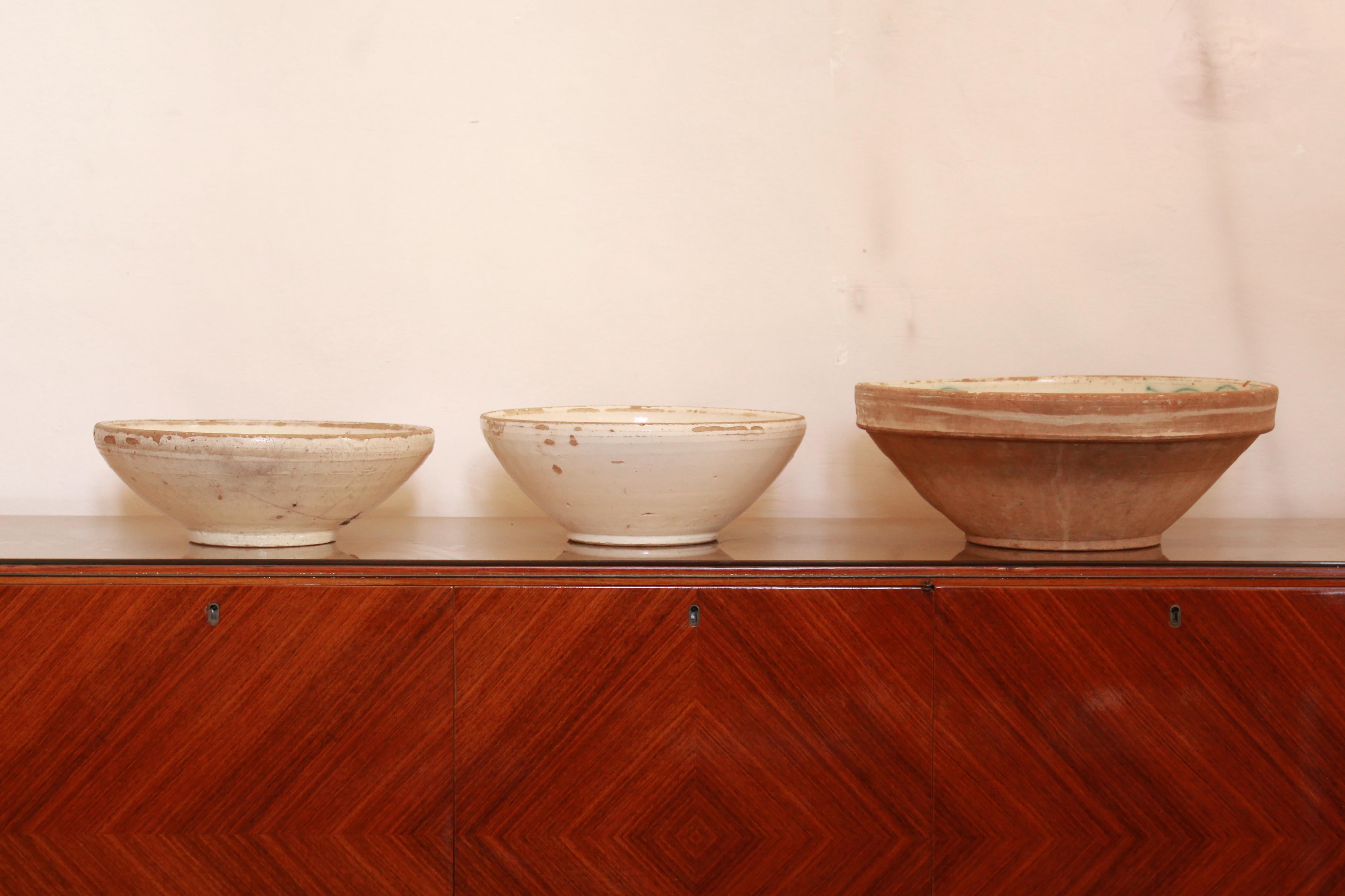 Three antique ceramic bowls in typical Apulian style (south of Italy) form the late 19th century. Pure example of handmade Italian ceramist capabilities. Signs of very old repairs visible on one of the cups. Quite few sign of times on the structures