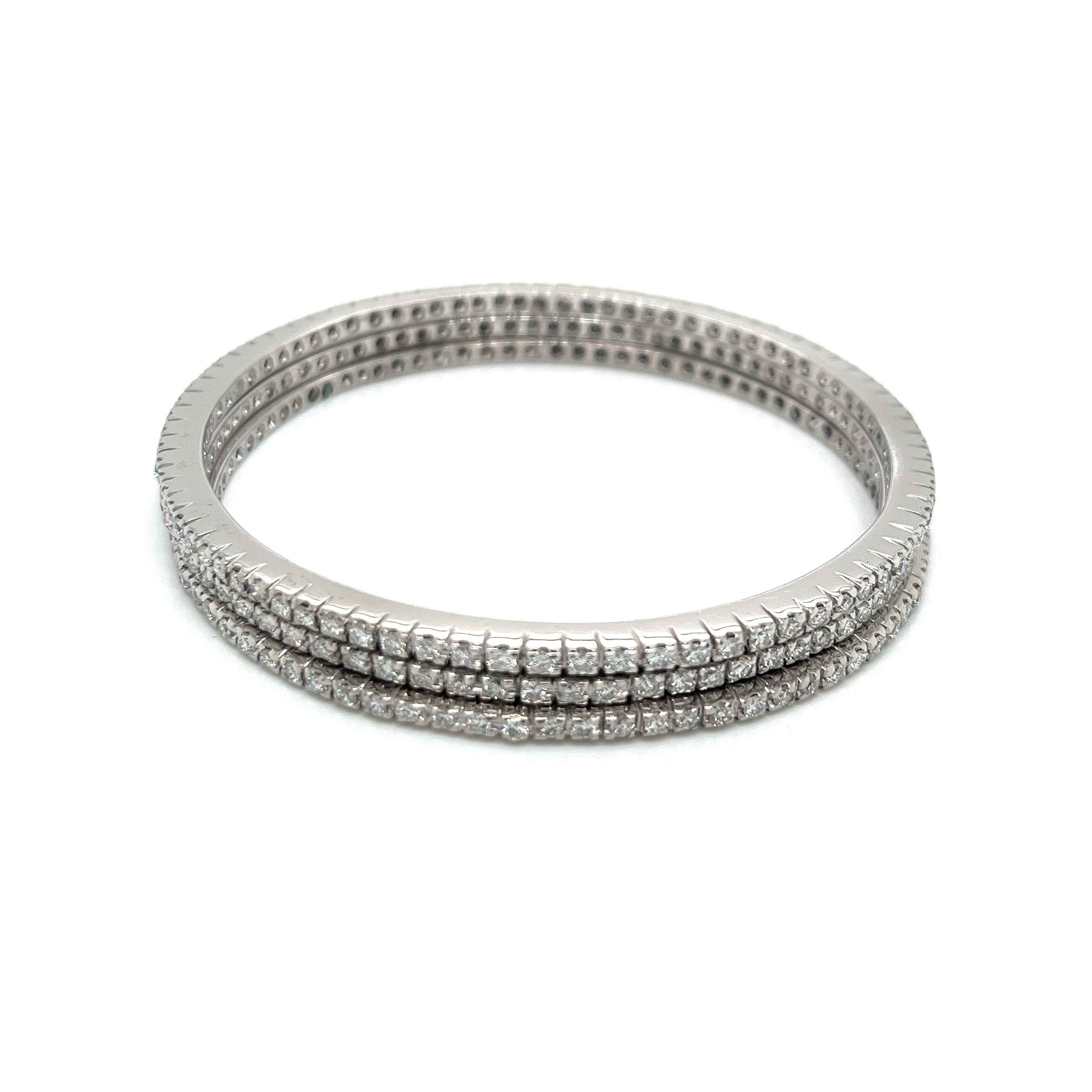 Exquisite Set of Three 18kw Diamond Stacking Bangles:
Indulge in the ultimate luxury with this stunning set of three stacking 18k white gold diamond bangles. Each bangle is a masterpiece of fine Italian jewelry craftsmanship, designed to captivate