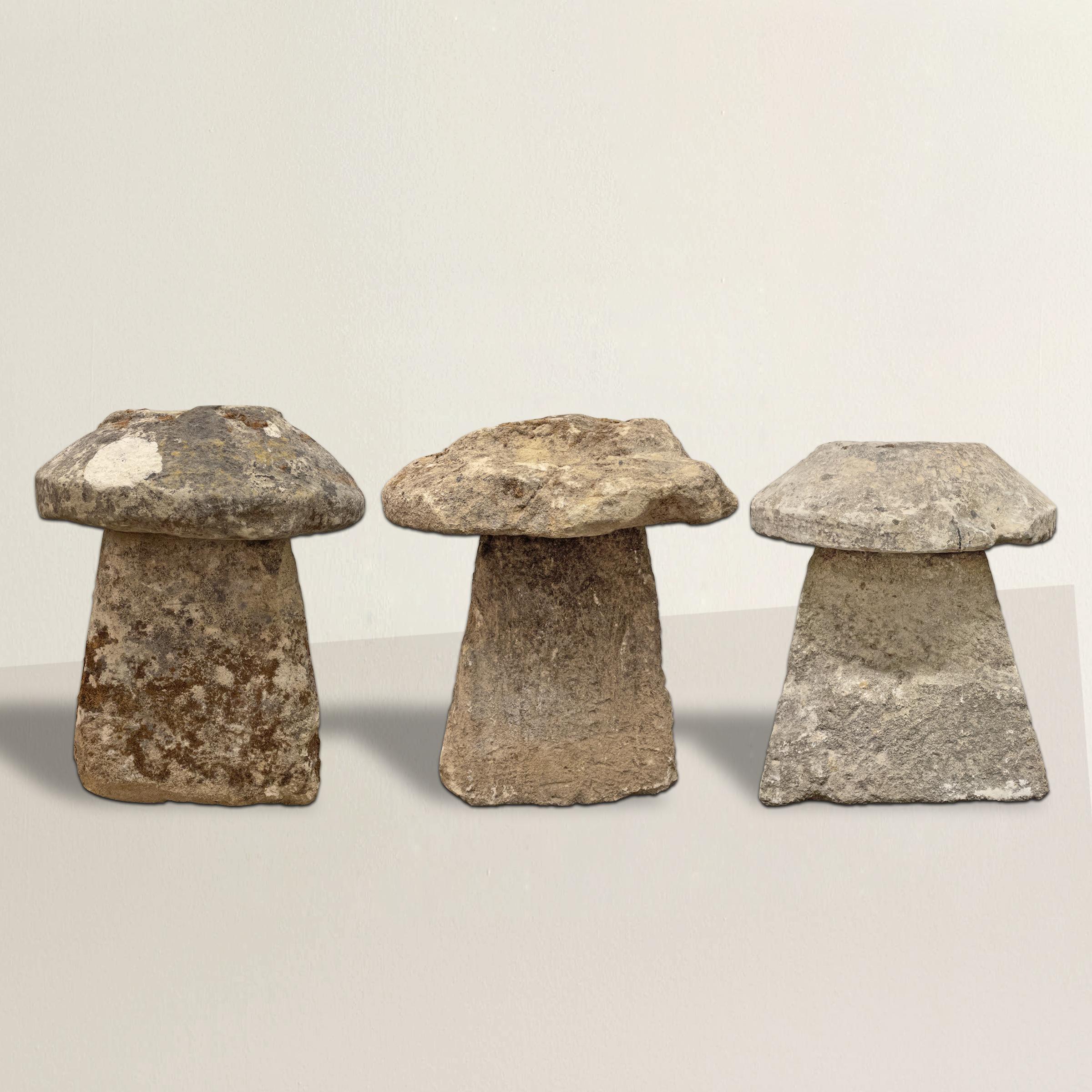 A wonderful set of three 18th century English carved limestone staddle stones with the most wonderful aged surfaces, natural lichens, and wear that only 300 years of use can bestow. Staddle stones were used to elevate granaries off the ground, and