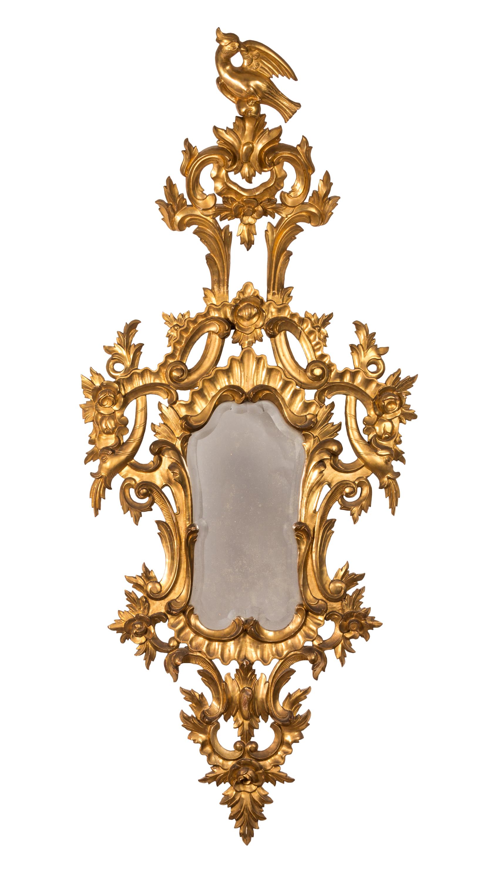 Trio of 18th century French Rococo mirrors, with finely carved and gilded wood frames. 
Design elements including plants and flowers, spouting fish, and the typical Rococo 