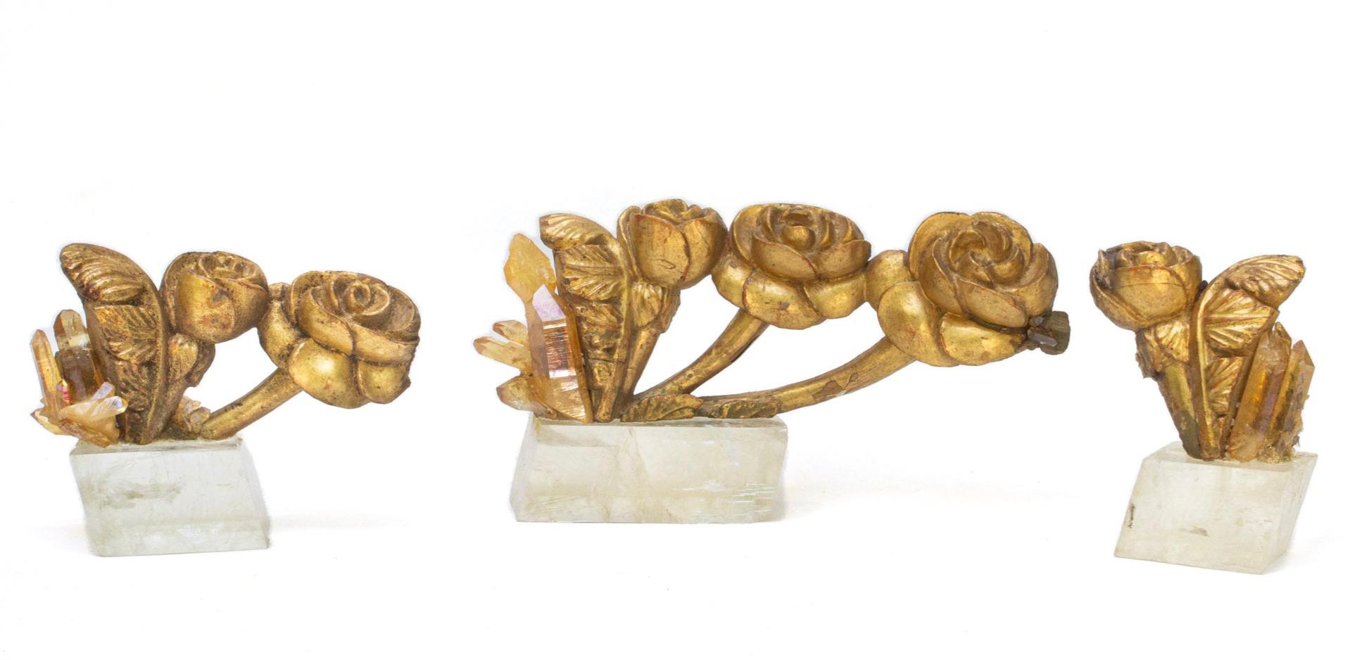 Set of three 18th century Italian gold leaf hand-carved wood flower fragments adorned with aurora quartz and each mounted on a calcite optical base. The fragments originally came from a larger decorative structure in a historical church in