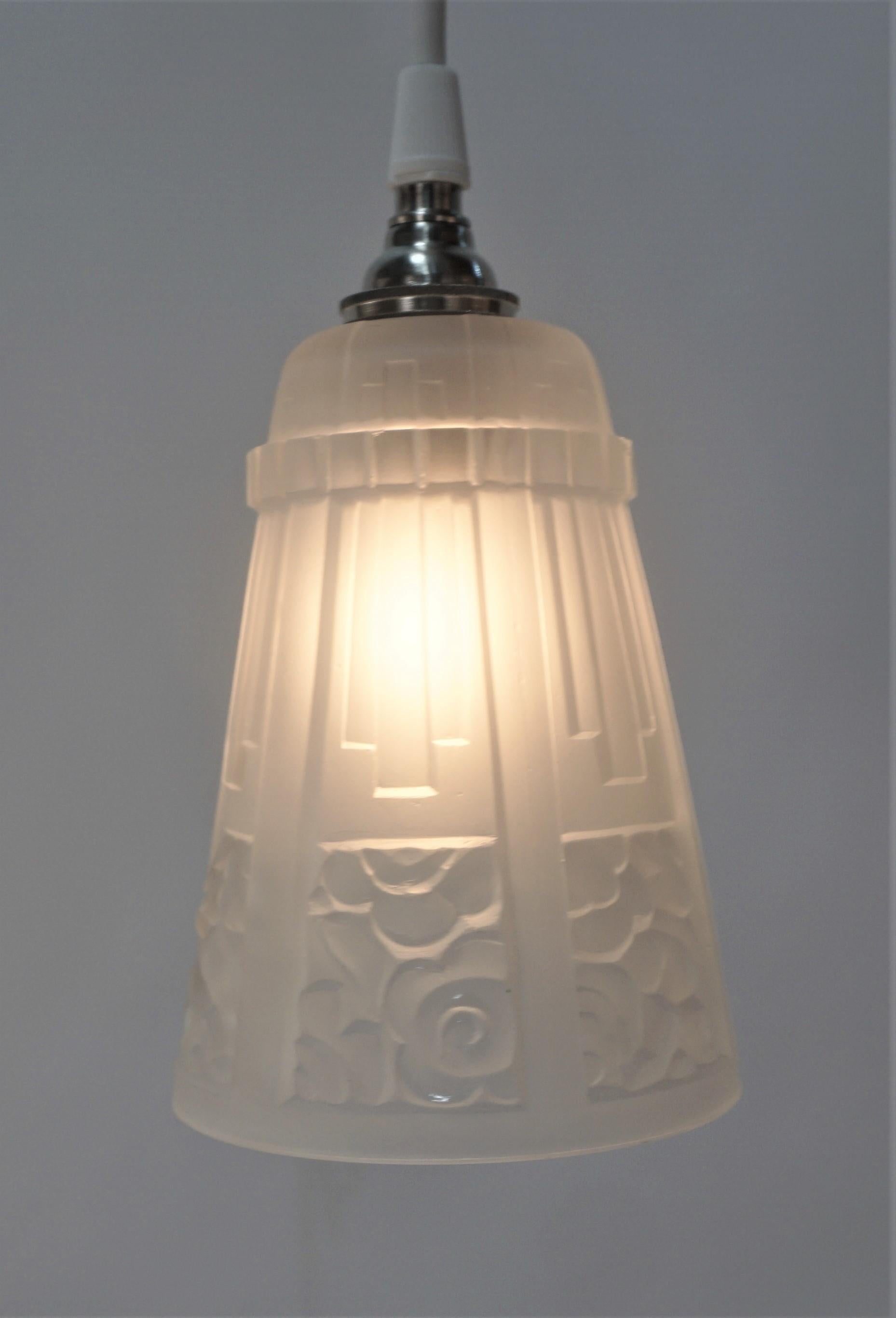 Set of thee French 1920's Art Deco glass shades have been modified with new brushed nickel canopy as pendant lights.
Measures: Glass is 4.25