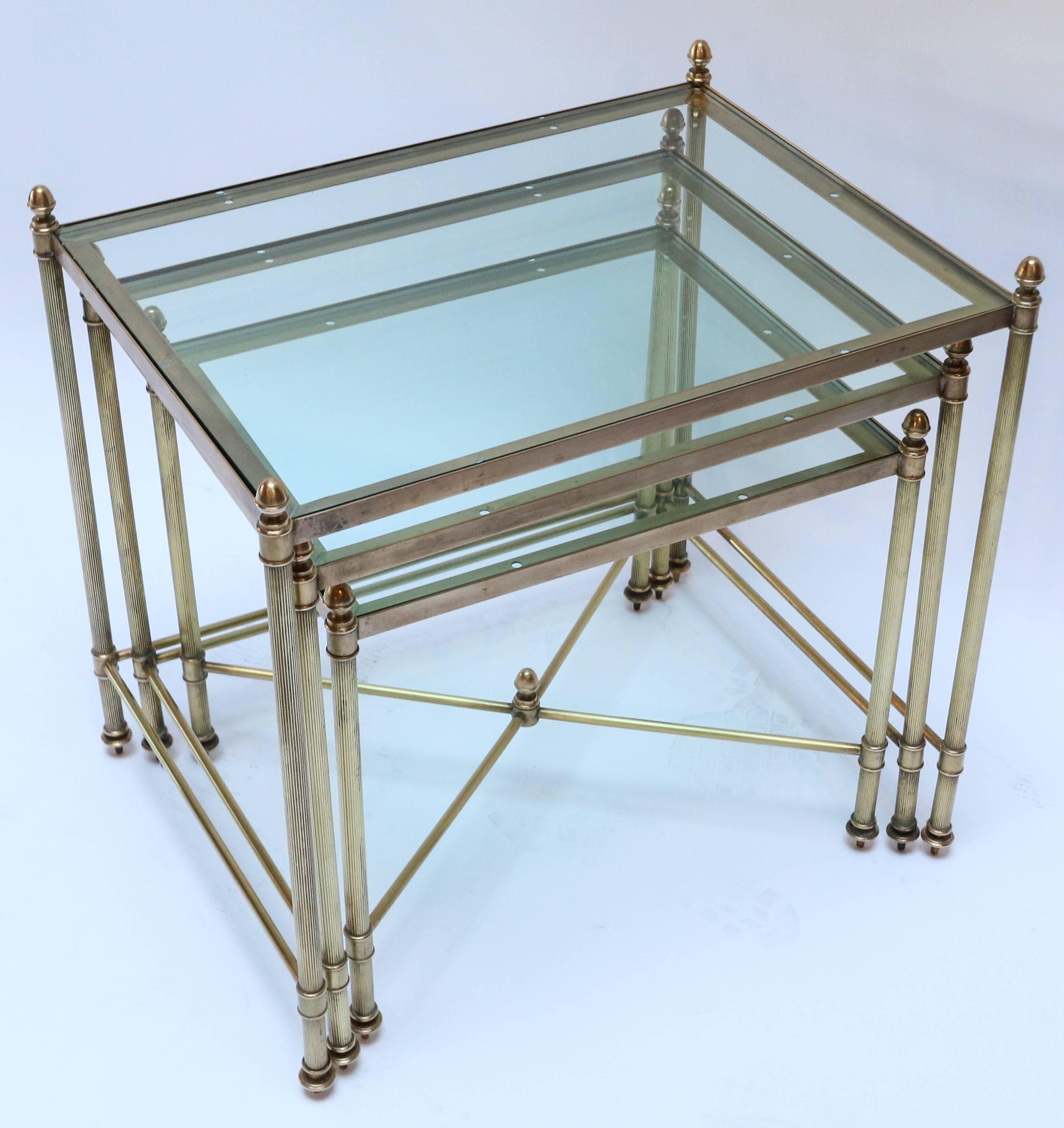 Set of three 1960s Italian brass nesting tables with finials and decorative details.

Measures: Large: 19in x 14in x 18.5in high
Medium: 17in x 13in x 16.5in high
Small: 115in x 112in x 14.5in high.