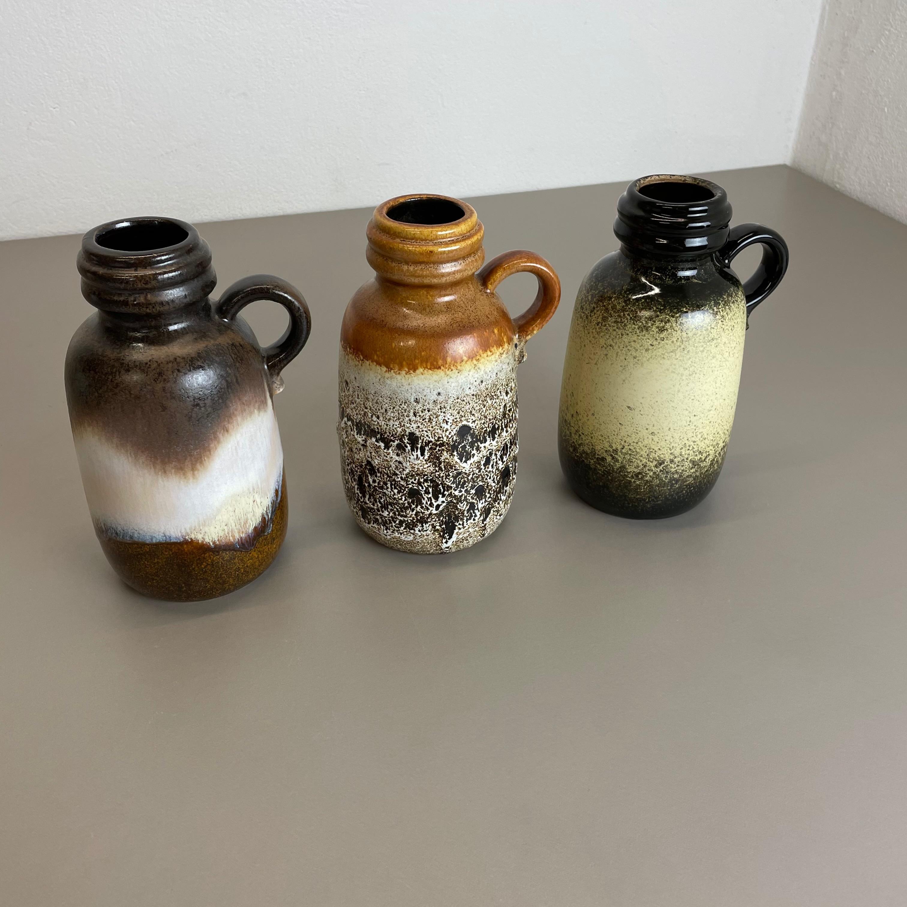 Article:

Set of three fat lava art vases

Model: 
413-20

Producer:

Scheurich, Germany



Decade:

1970s


 

These original vintage vases was produced in the 1970s in Germany. It is made of ceramic pottery in fat lava optic.
