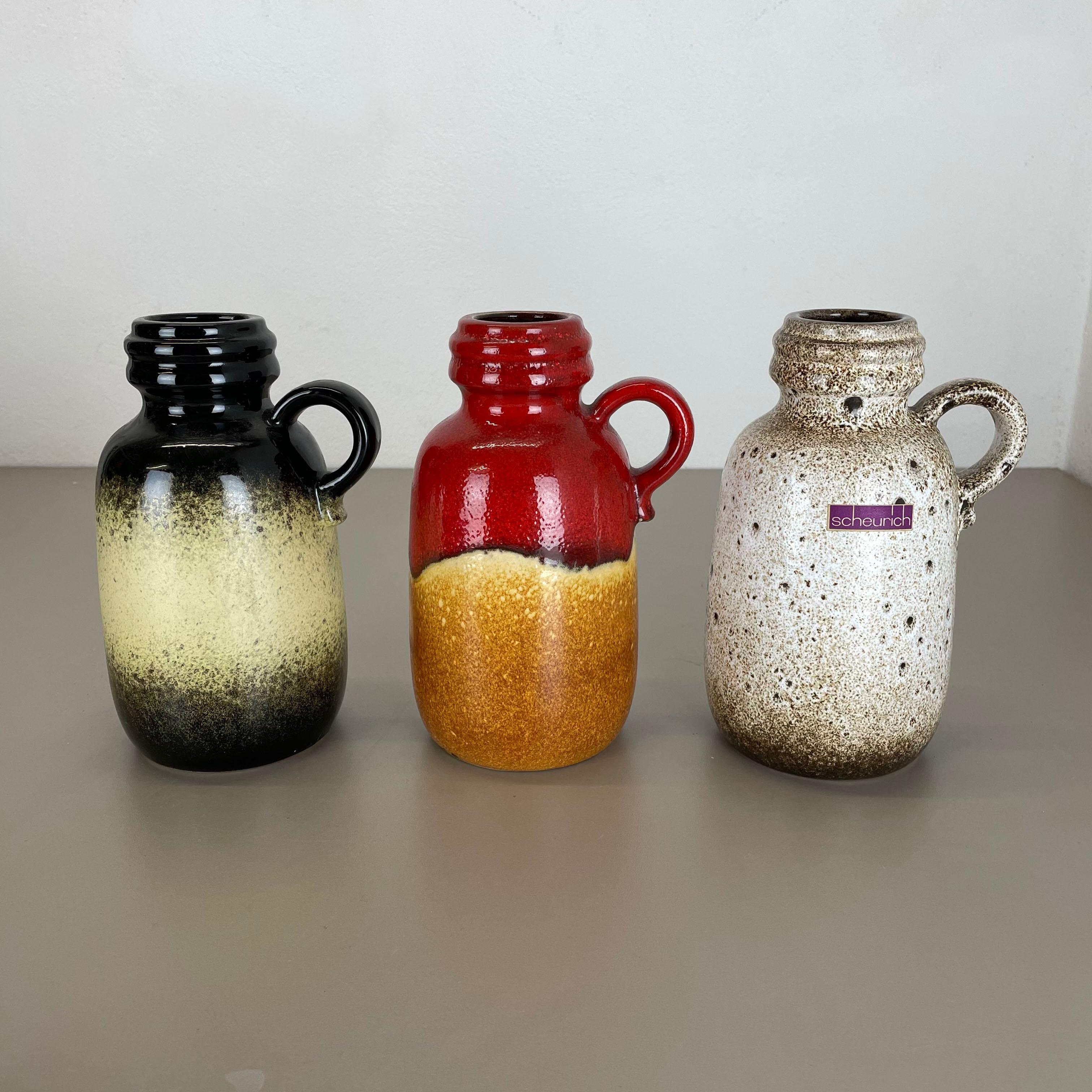 Article:

Set of three fat lava art vases

Model: 
413-20

Producer:

Scheurich, Germany



Decade:

1970s


 

These original vintage vases was produced in the 1970s in Germany. It is made of ceramic pottery in fat lava optic.