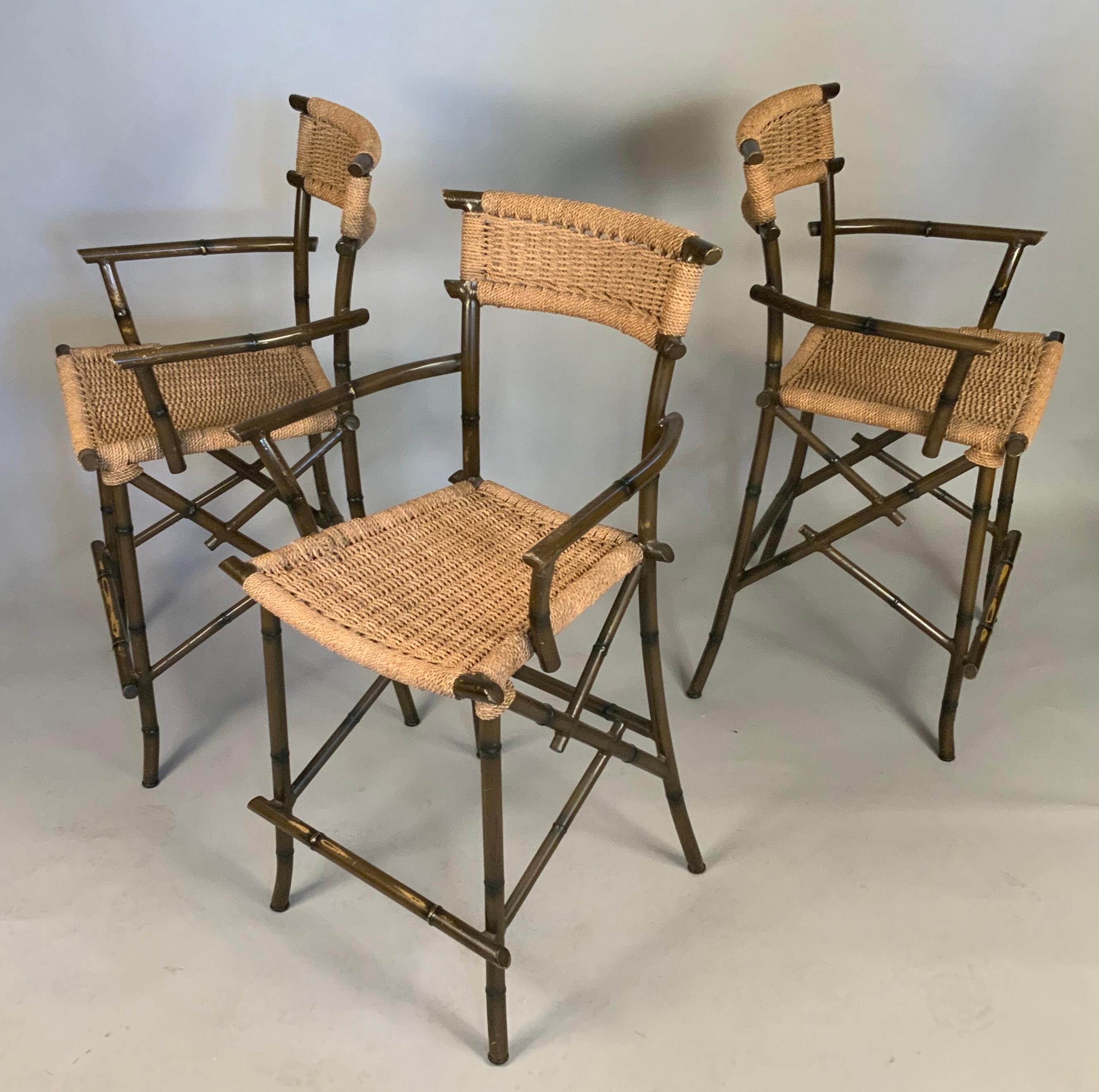 a set of three very handsome barstools, with steel frames in a faux bamboo pattern, and seats and backs in woven rope. great design and scale, very comfortable and stable. light wear overall.