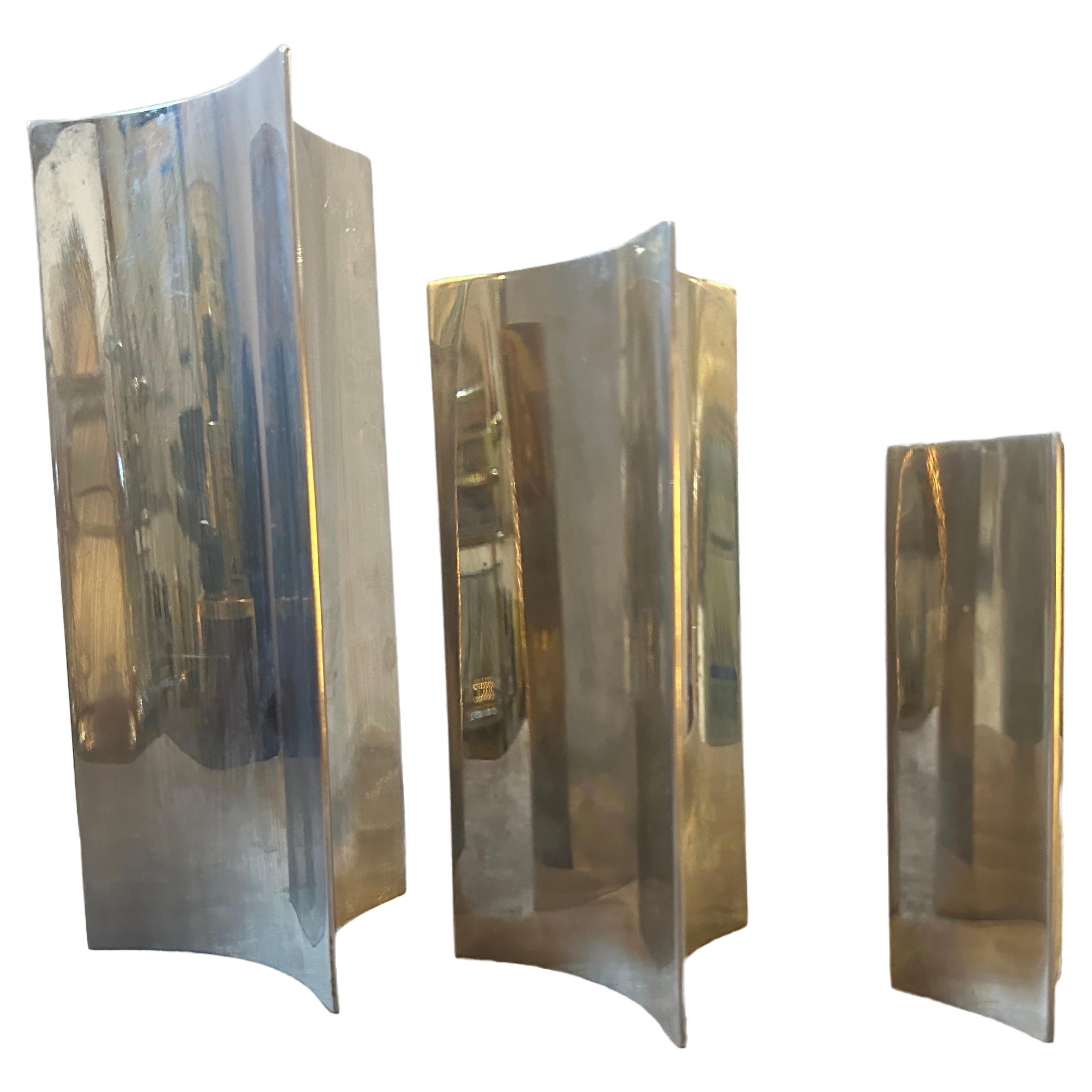 Three triangular steel vases designed and manufactured in Italy in the Eighties, they are in good conditions, height of the medium vase is 20 cm, the height of the small one is 15 cm. They are a striking examples of contemporary design. Their