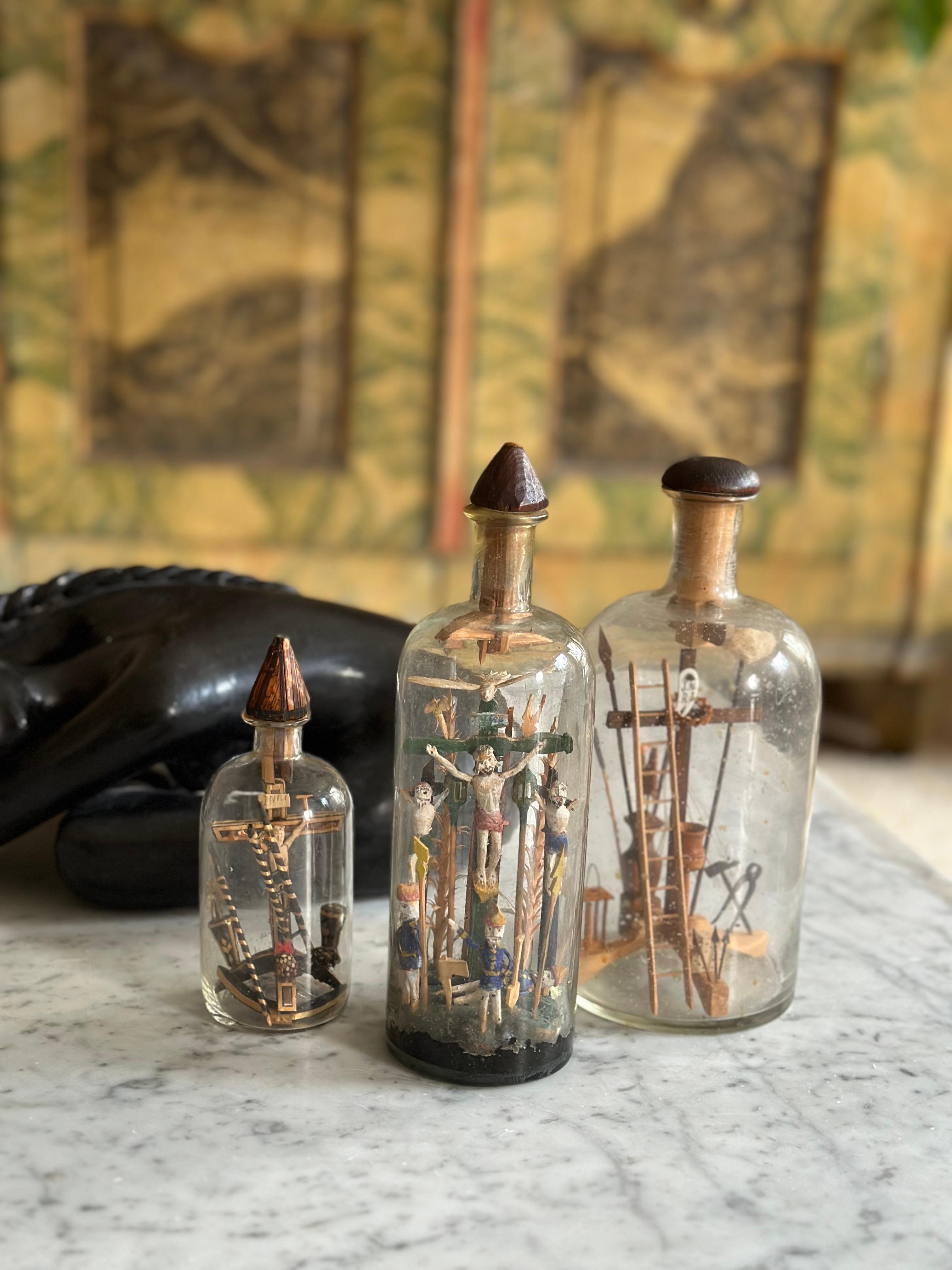 Glass Set of Three 19th-Century Alpine Patience Bottles with Crucifixion Scene