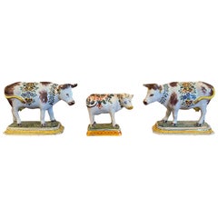 Set of Three 19th Century Dutch Delft Polychrome Porcelain Cows, One Marked