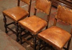 Set of Three 19th Century French Carved Oak and Brown Leather Bar Stools