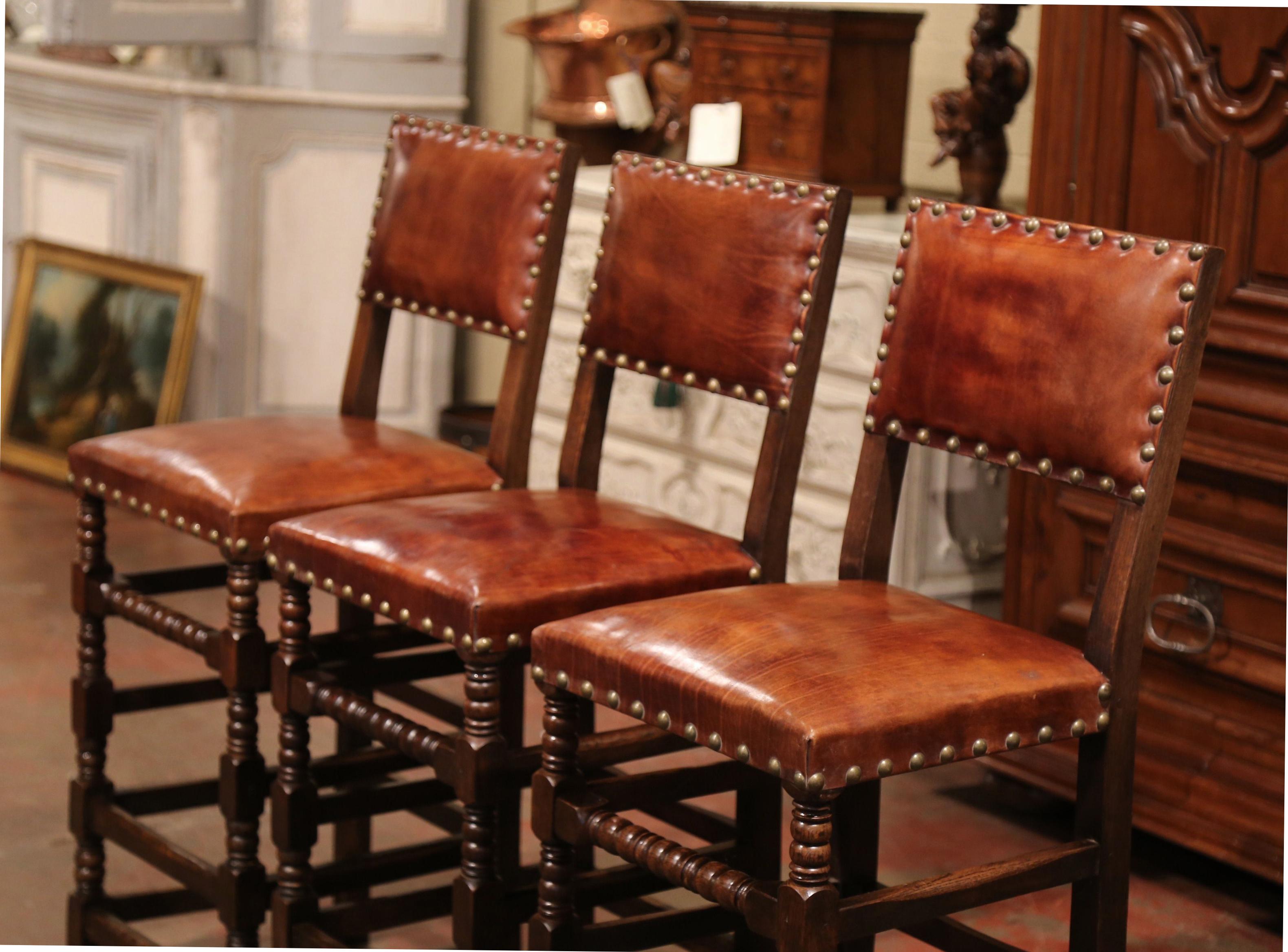 Louis XIII Set of Three 19th Century French Carved Oak and Brown Leather Bar Stools