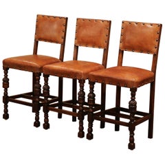 Antique Set of Three 19th Century French Carved Oak and Brown Leather Bar Stools
