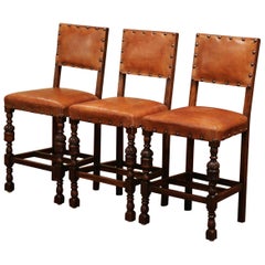 Set of Three 19th Century French Carved Oak and Brown Leather Bar Stools