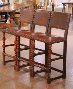 Set of Three 19th Century French Gothic Carved Oak and Leather Bar Stools