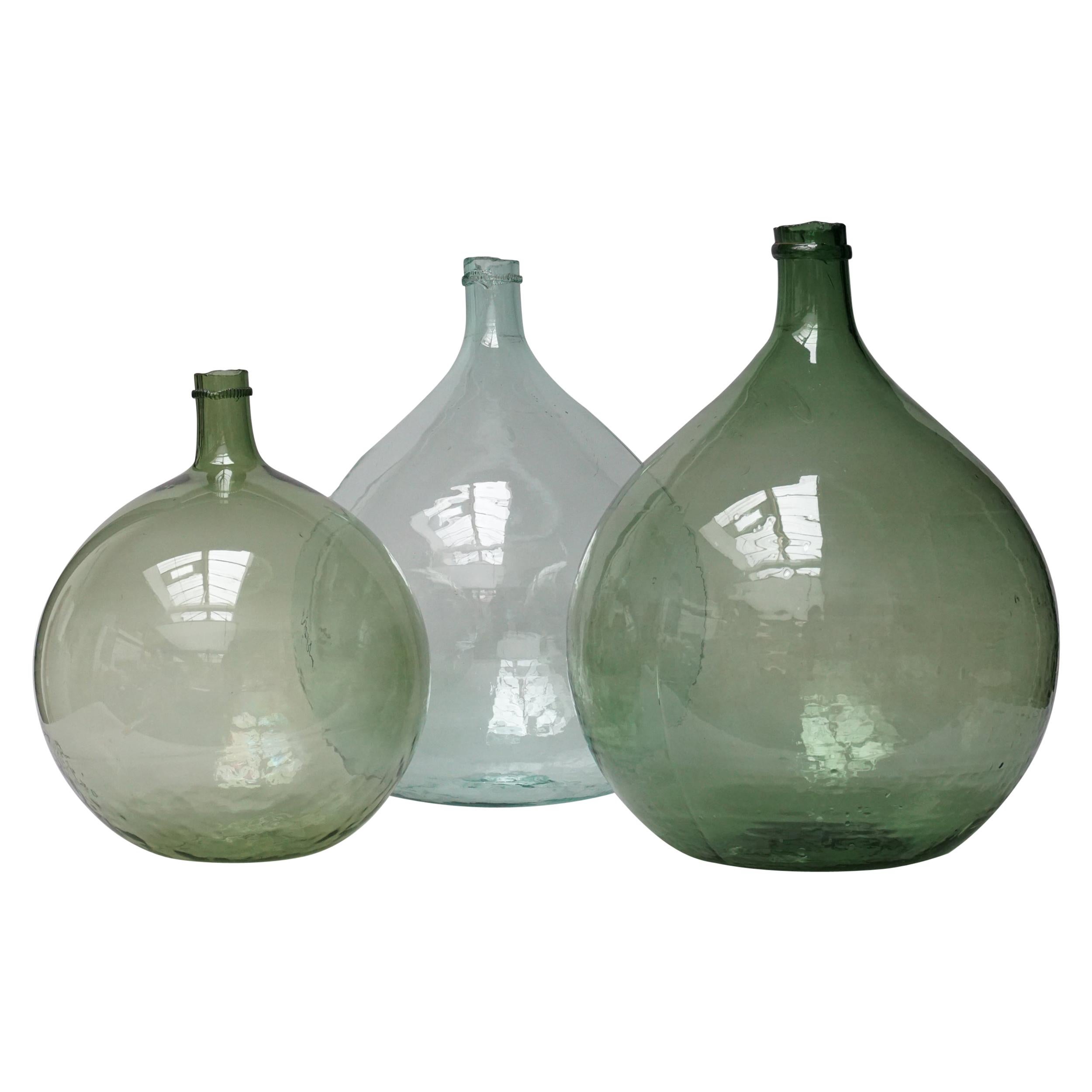 Set of Three 19th Century Large Blown Dame Jeanne, Bonbonne Green Glass Bottles