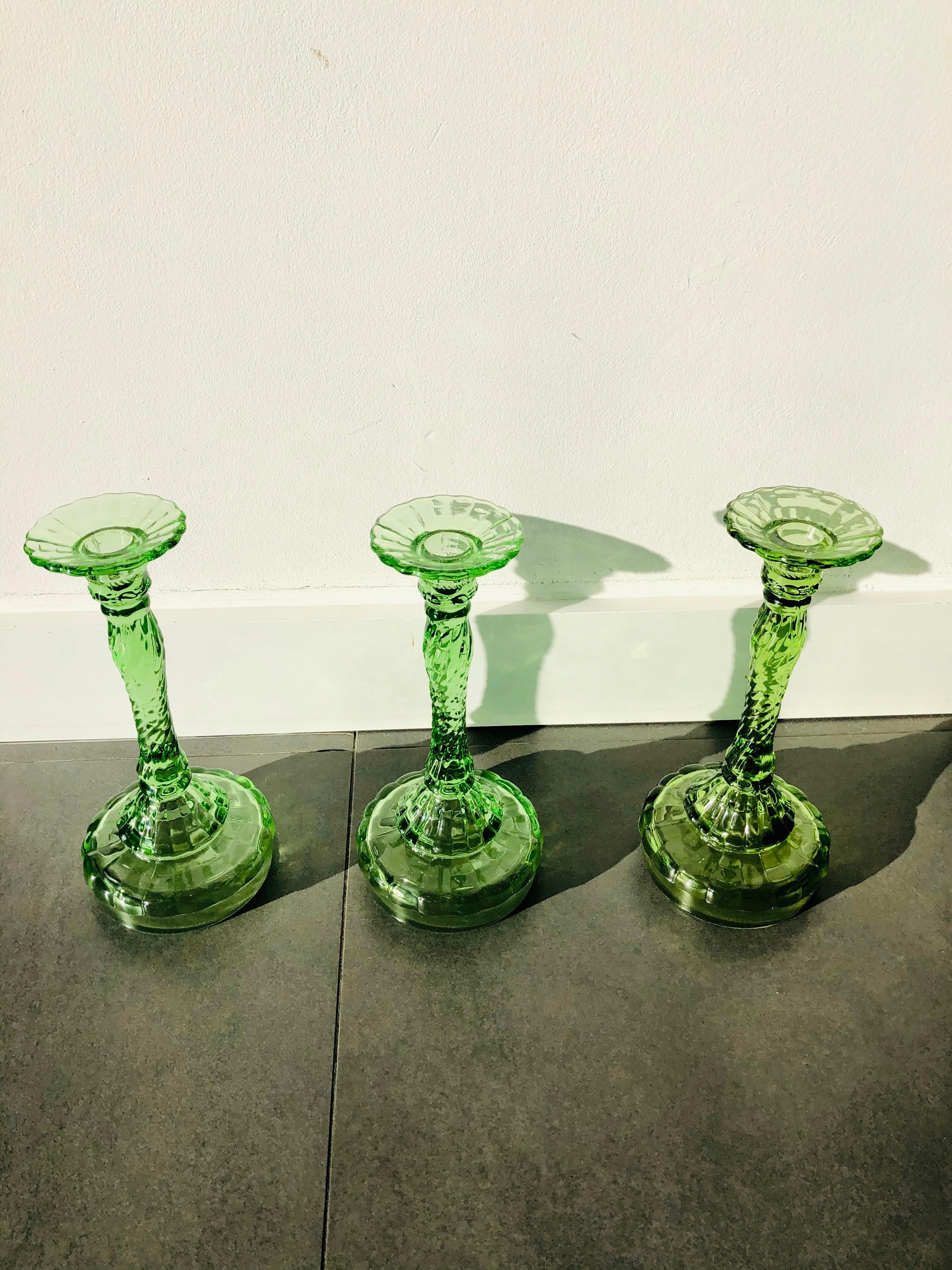 Set of three midcentury Polish modern glass candlesticks, circa 1960. Very good condition. No damages. Beautiful green glass.